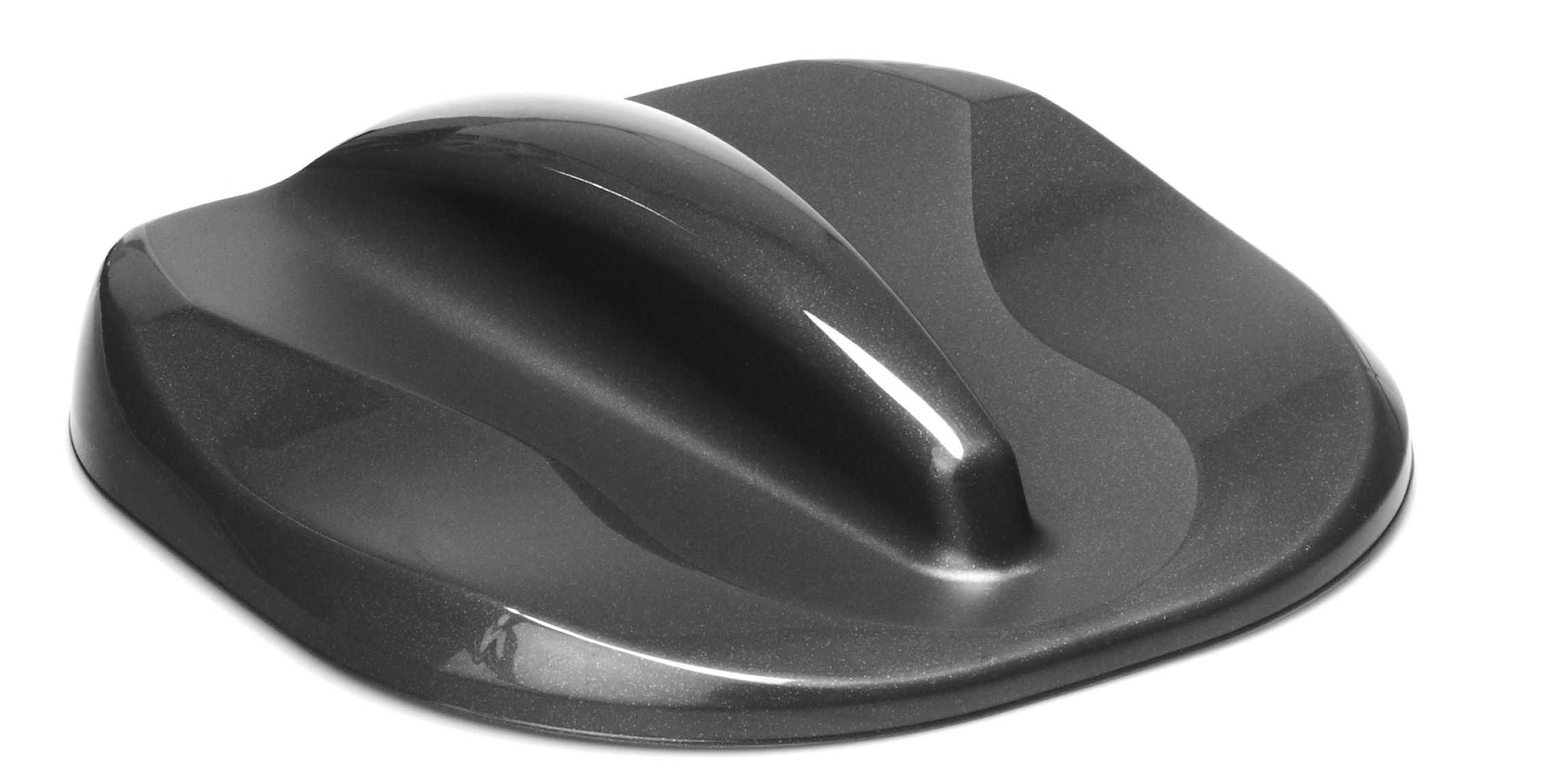 Szary plastikowy przedmiot. Ma podniesioną sekcję na górze i zakrzywiony kształt.