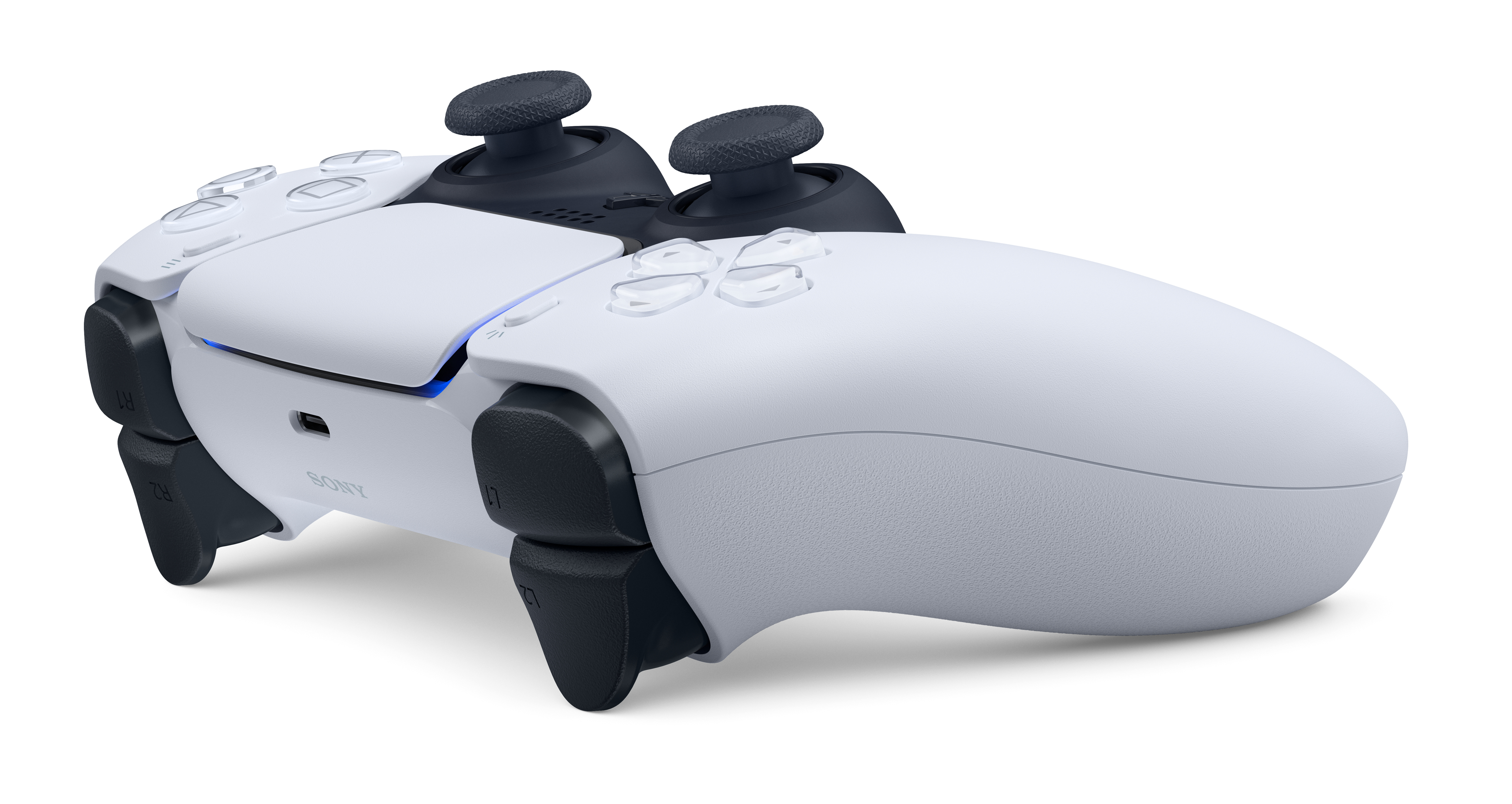 Siyah kumandalı beyaz PlayStation 5 kontrolcüsü, beyaz arka plan üzerinde.