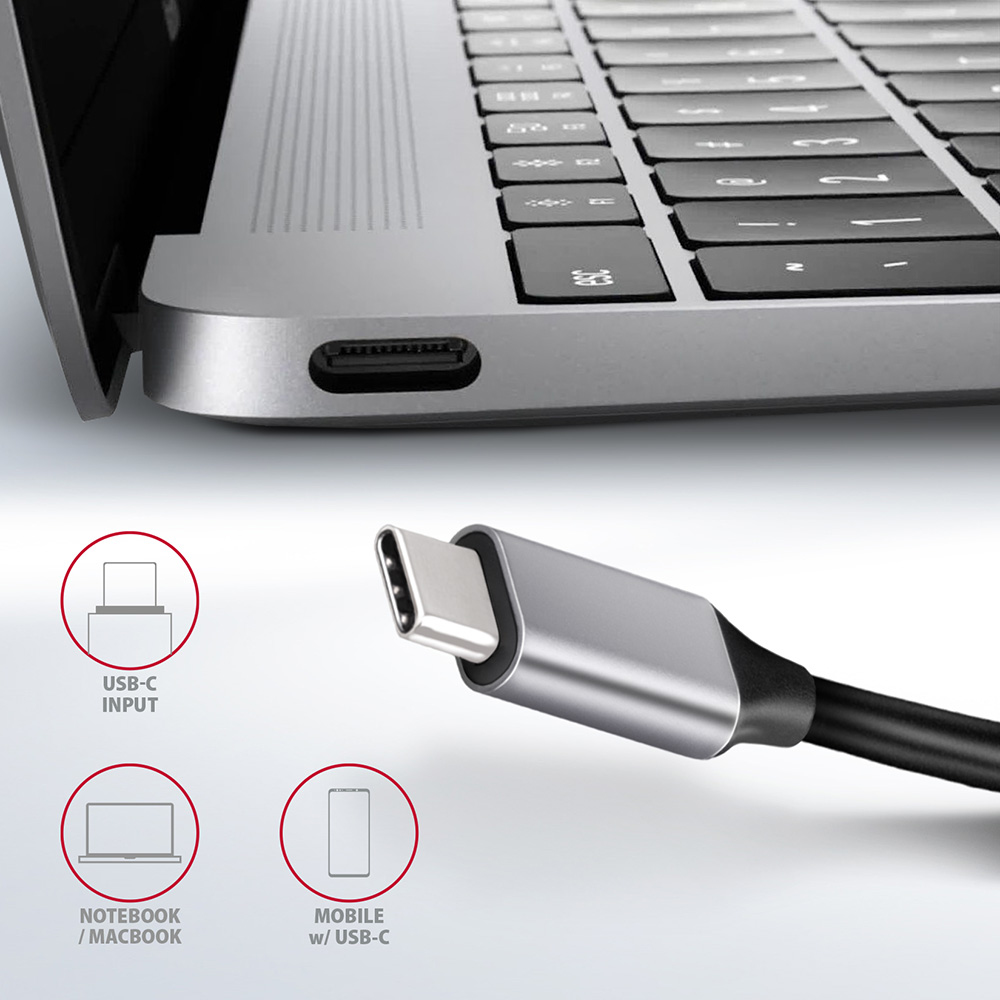 Nahaufnahme eines Laptops mit angeschlossenem USB-C-Kabel. Diagramme, die seine Verwendung zeigen.