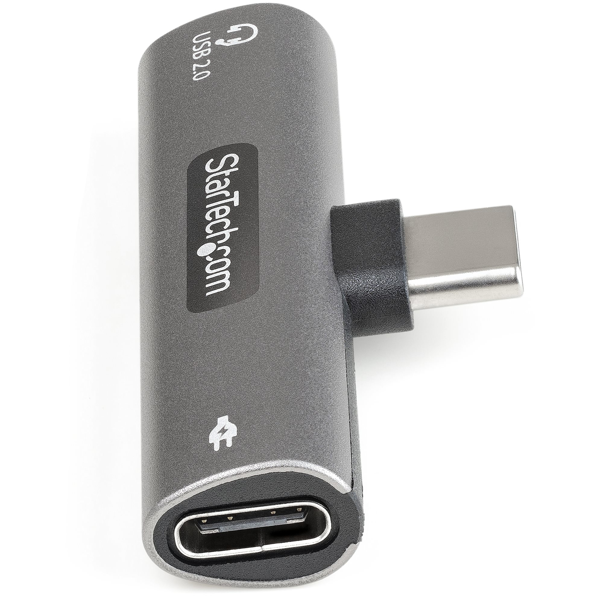 Adaptador USB-C gris. Tiene puertos USB 2.0 y USB-C. Presenta el logotipo de Startech.com.