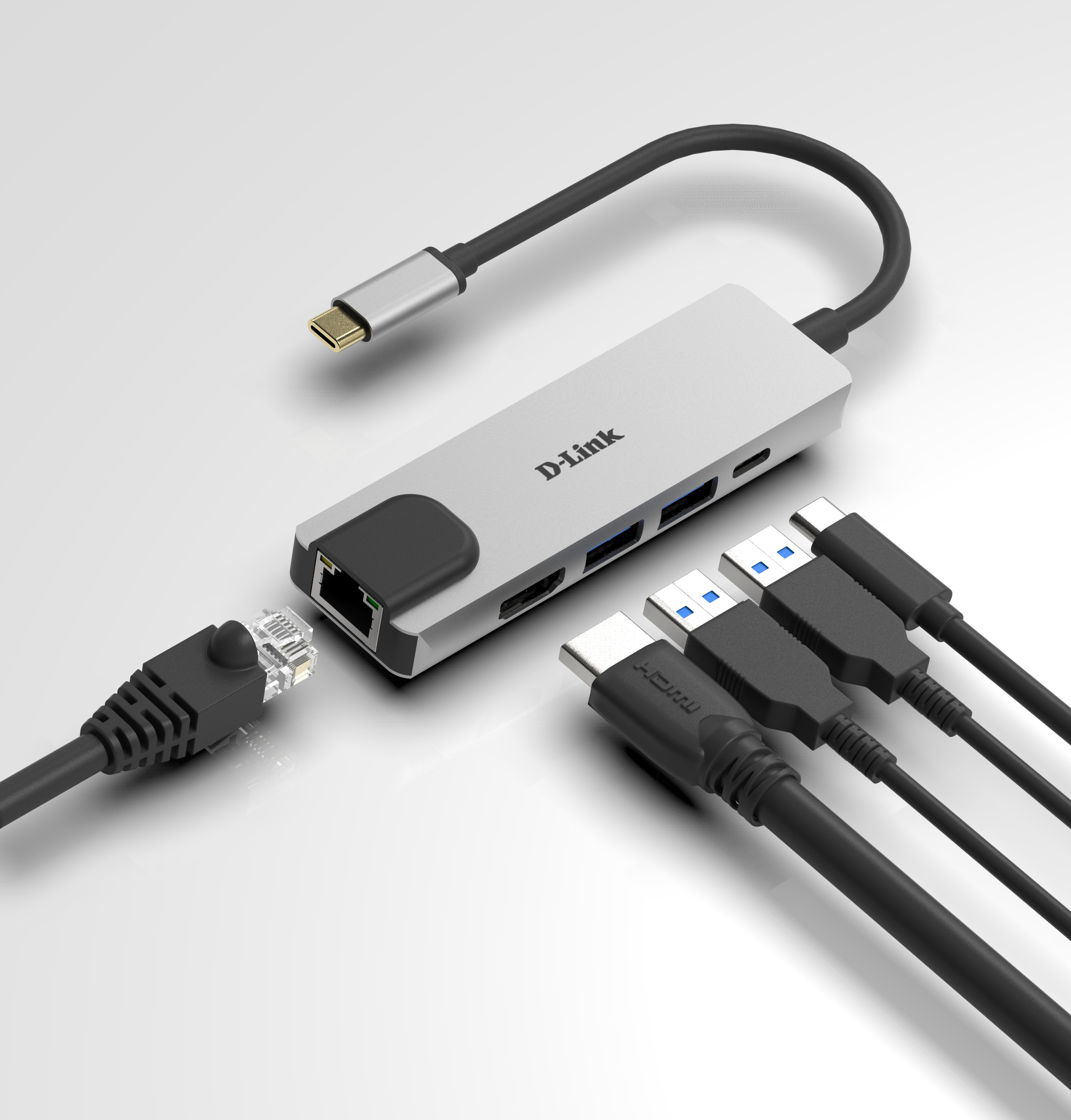 Hub USB D-Link con vari cavi collegati, su una superficie bianca. Cavo Ethernet.