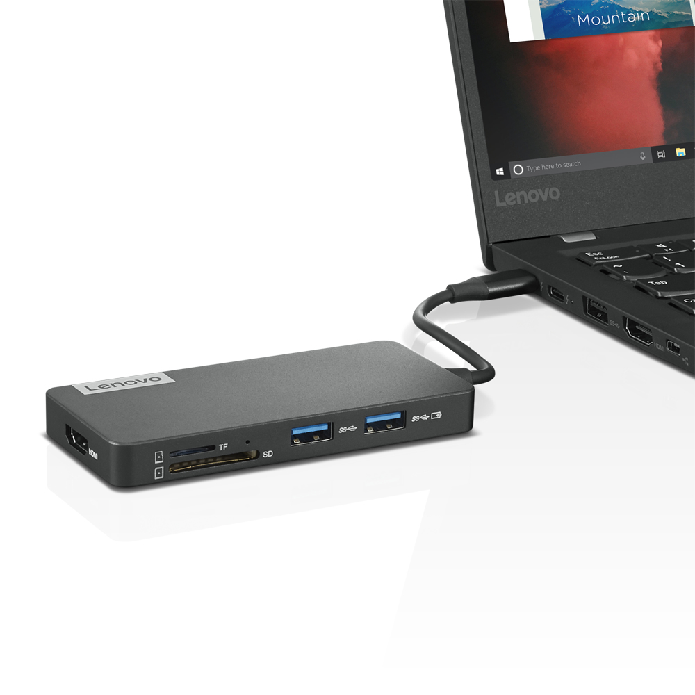 Schwarze Lenovo-Dockingstation, verbunden mit einem Laptop mit SD-, TF- und USB-Anschlüssen.