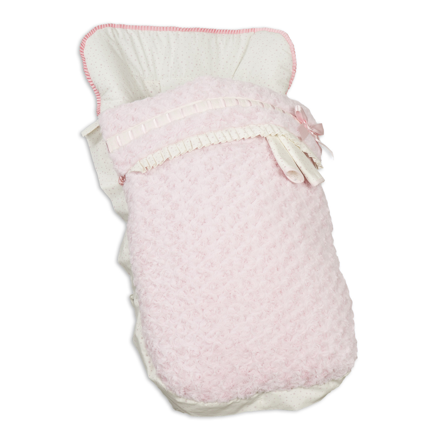 Saco de dormir rosa para bebé con forro blanco con lunares y lazo rosa. Fondo blanco.
