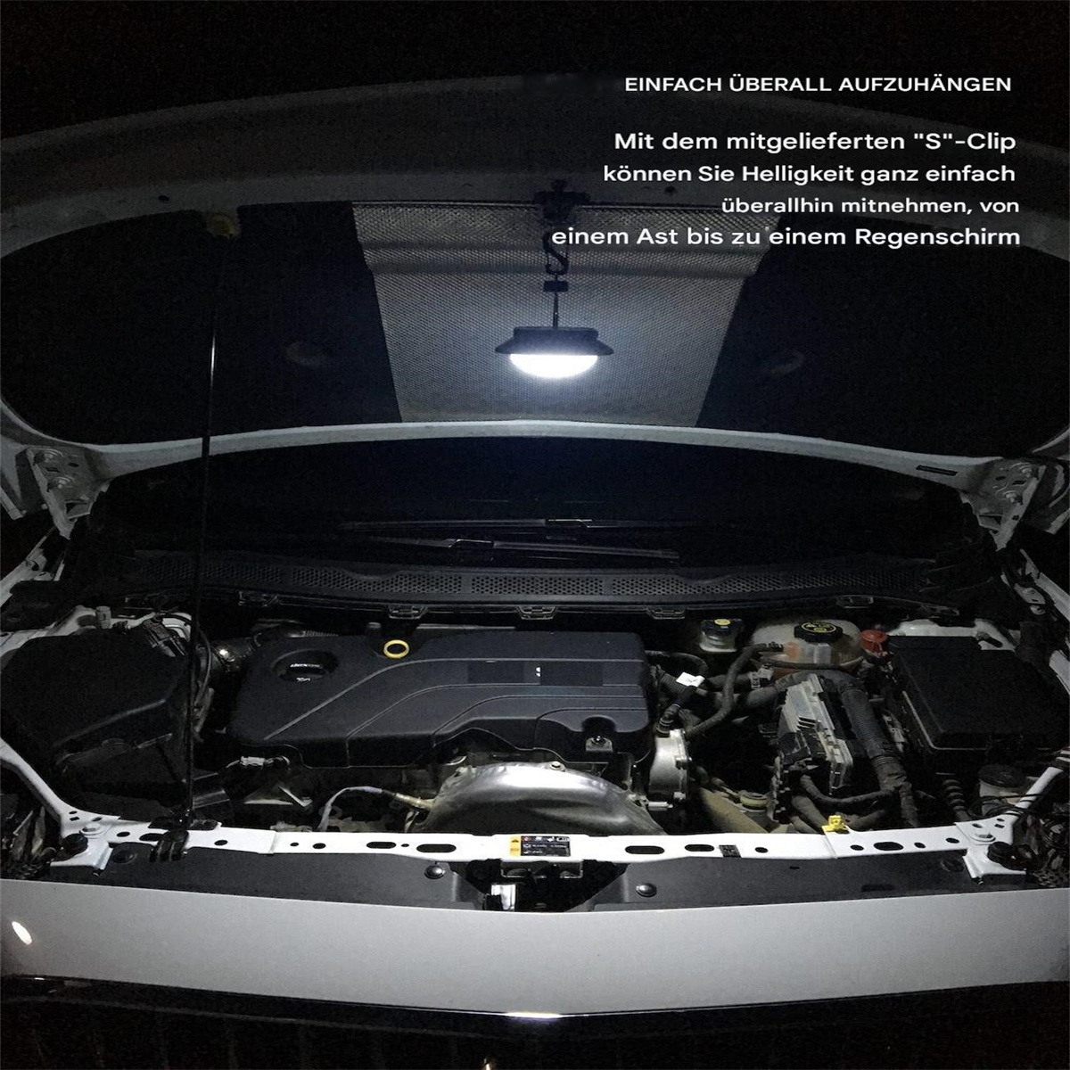 Automotor mit Licht, das von der Motorhaube hängt, von innen aufgenommen.