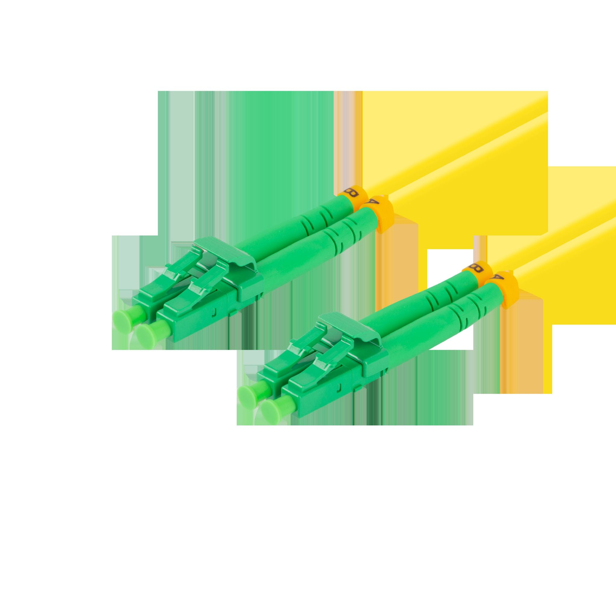 Zbliżenie dwóch zielonych złączy i żółtych kabli.