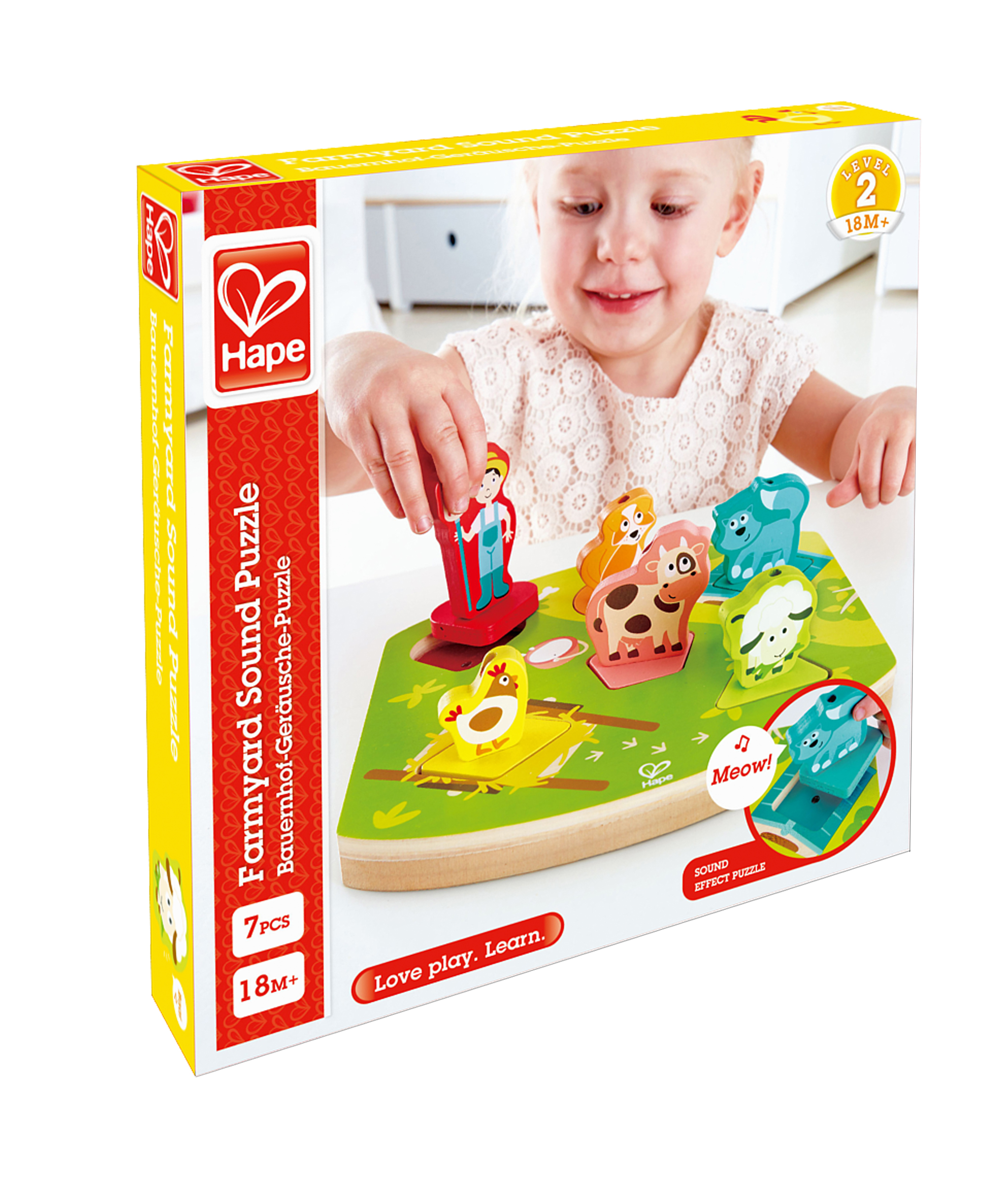Ein Kind spielt mit einem Bauernhof-Puzzle. Das Puzzle hat einen Jungen, Tiere und eine Bauernhofszene.