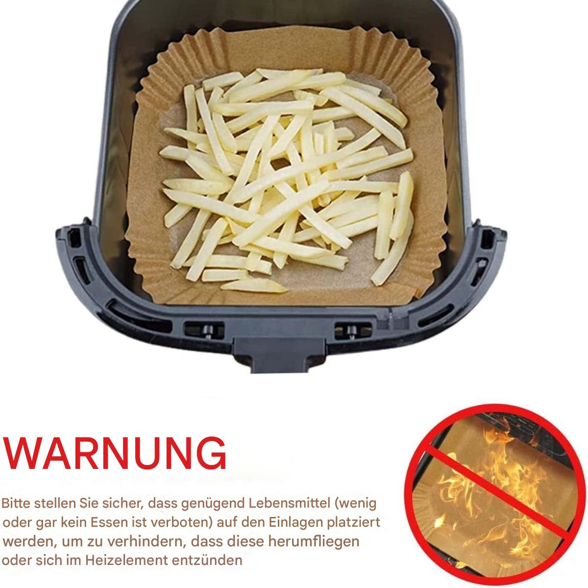 Heißluftfritteuse mit Pommes in einer Papiereinlage, Warntext und einem Gefahrensymbol.