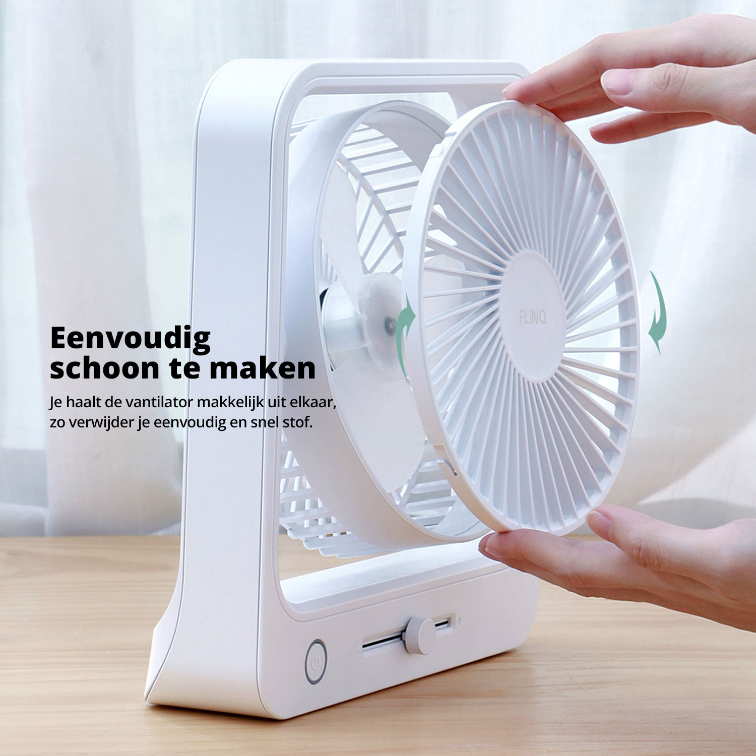 Ventilateur blanc avec pales rotatives. Les mains montrent comment le démonter. Texte en néerlandais.