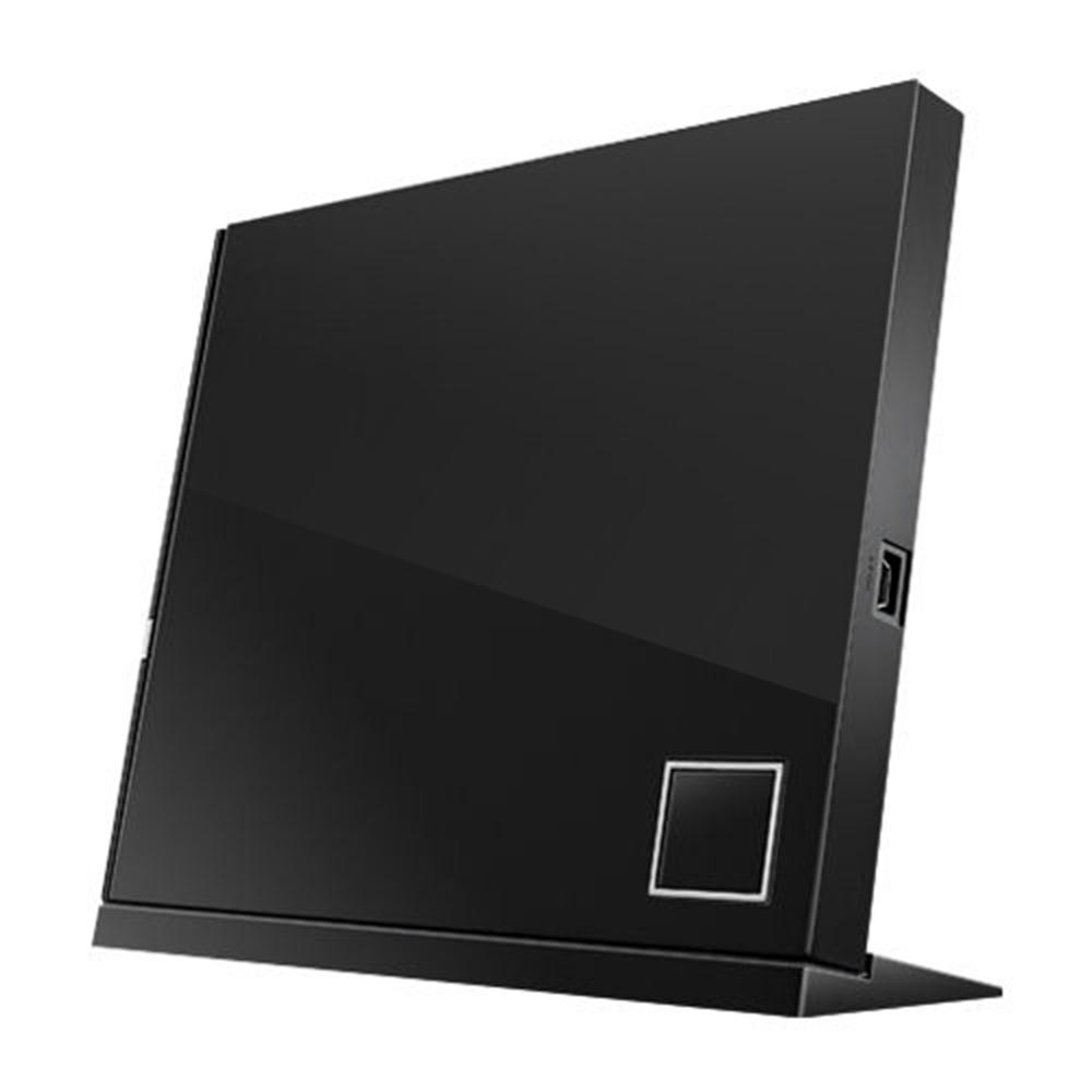 Unidad DVD externa ASUS negra sobre un soporte, con la marca visible, sobre fondo blanco.