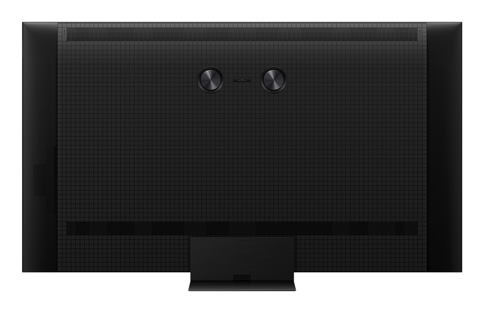 Tył dużego czarnego telewizora. Pokazuje wzór kratki, z przyciskami i podstawą.