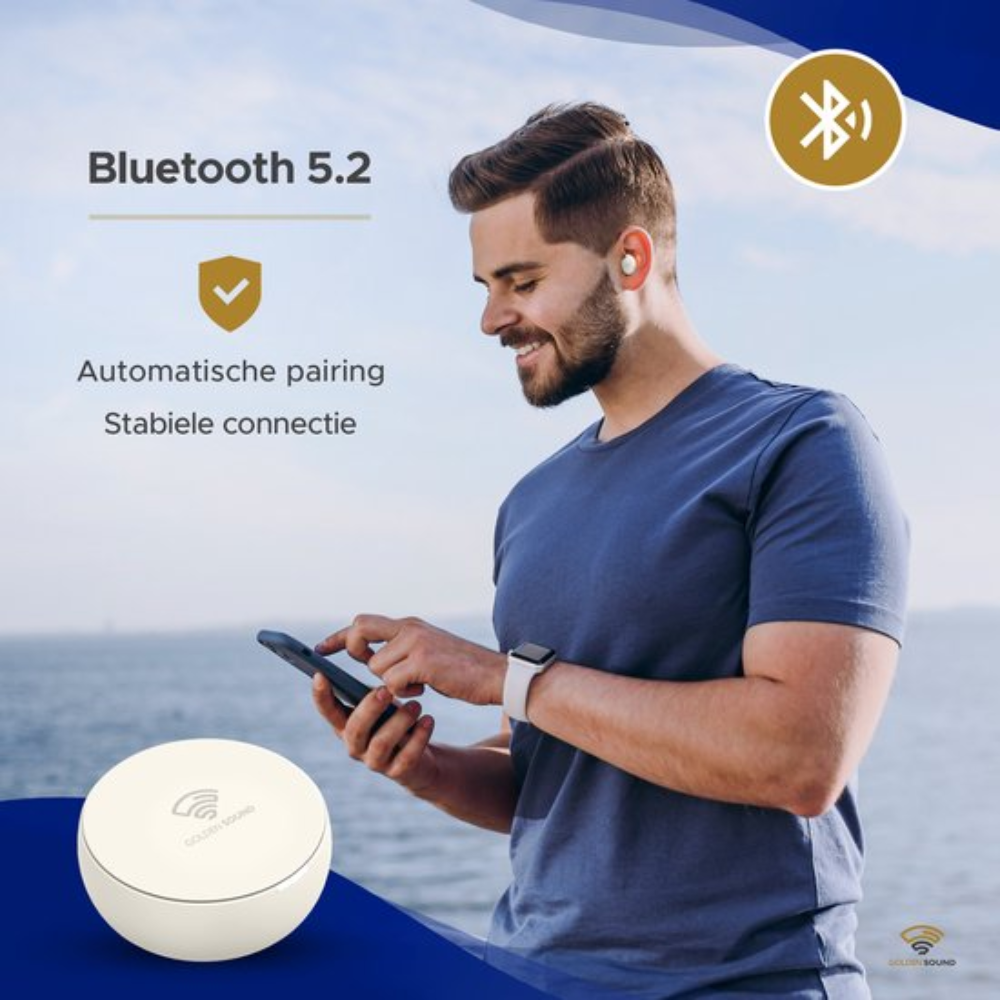 A man using his phone with wireless earbuds. The background features a sea and sky.