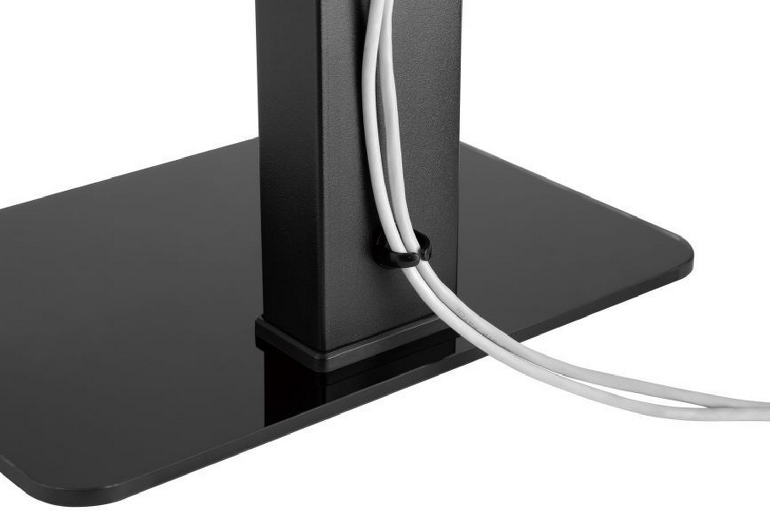 Base del supporto TV nera con gestione cavi. Cavi bianchi, colonna nera.