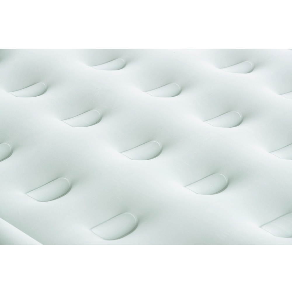 Close-up van een witte luchtmatras met afgerond, gestructureerd oppervlak.