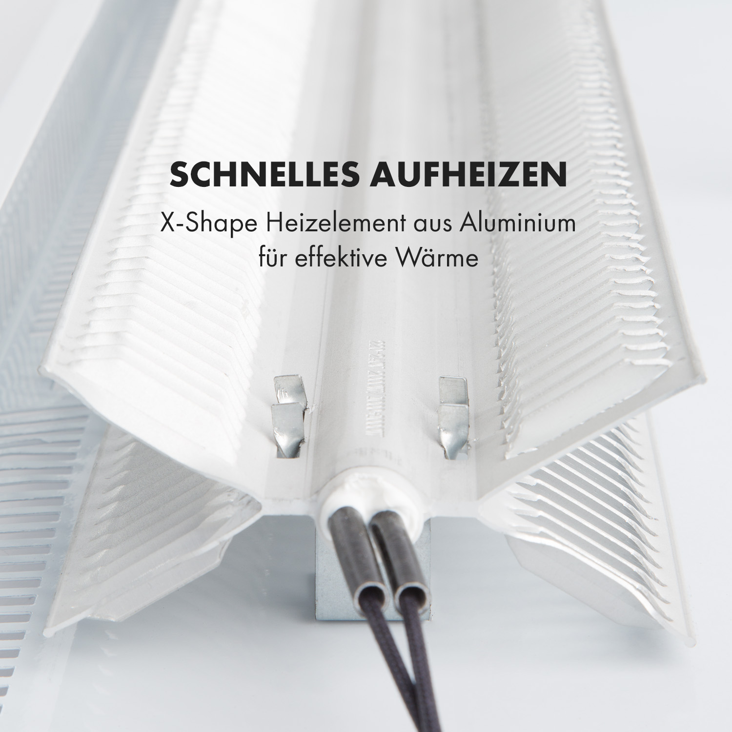 Primer plano de un calentador con un elemento calefactor en forma de X. Texto: SCHNELLES AUFHEIZEN.