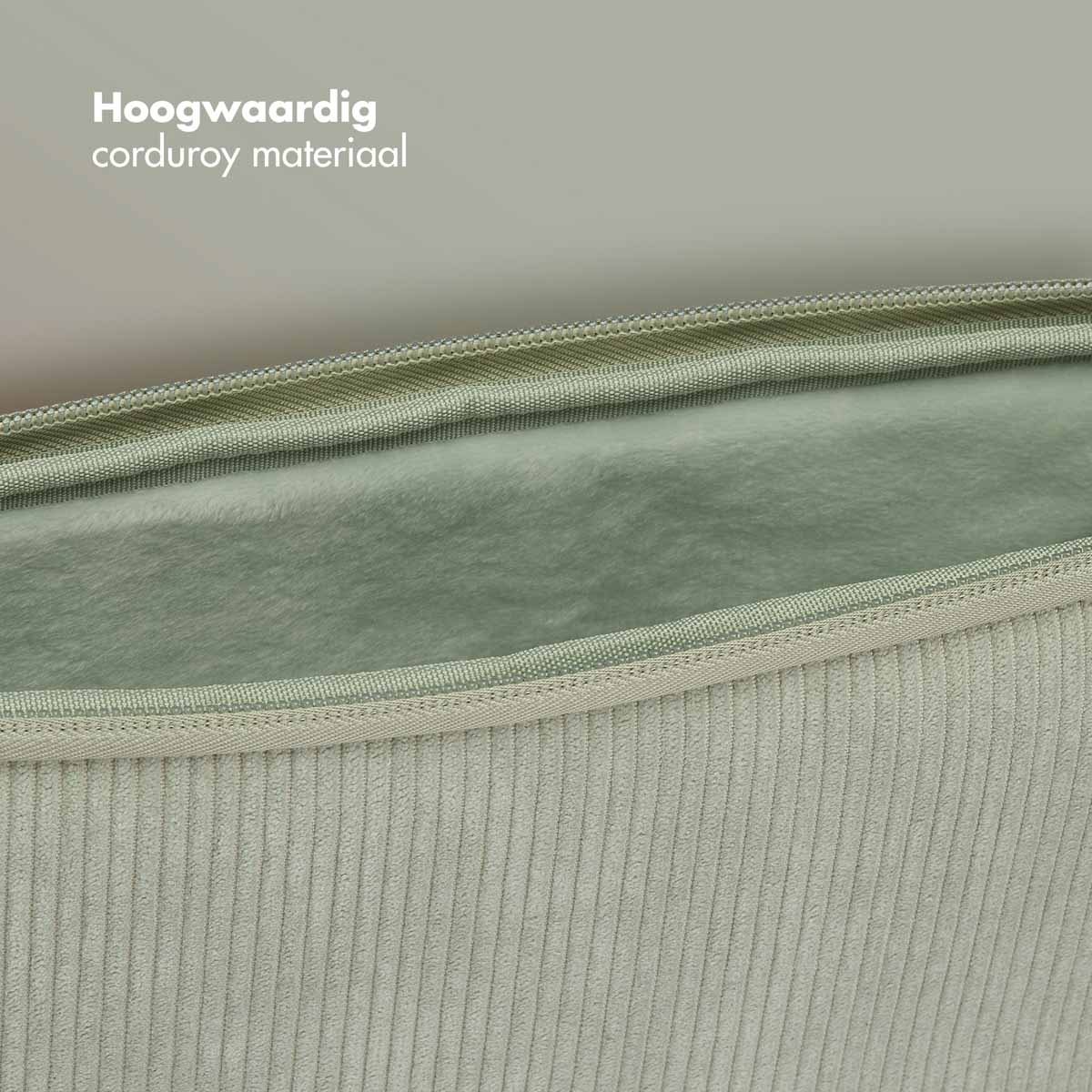 A close-up of a light green corduroy fabric with a soft, velvety texture. The fabric is folded open.