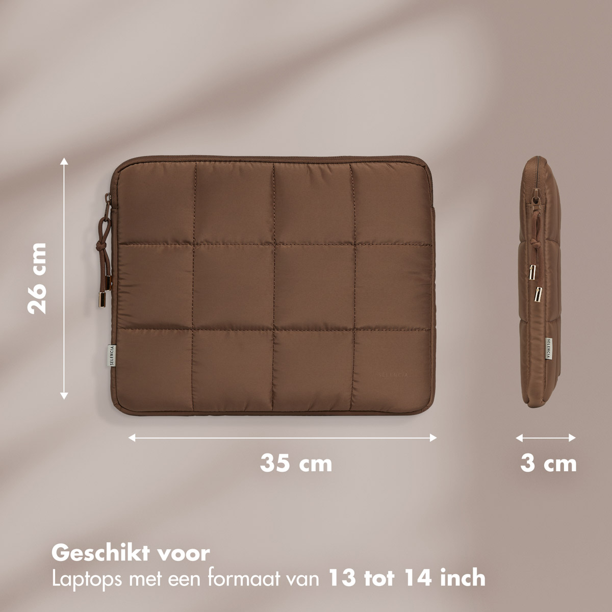 A brown laptop sleeve with dimensions of 26cm x 35cm x 3cm.  The label says it fits laptops 13-14 inches.