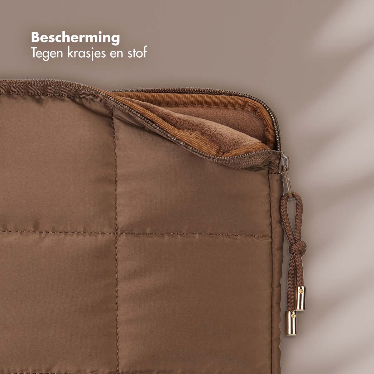 Brown quilted cover with zipper partially open, revealing a soft interior.
