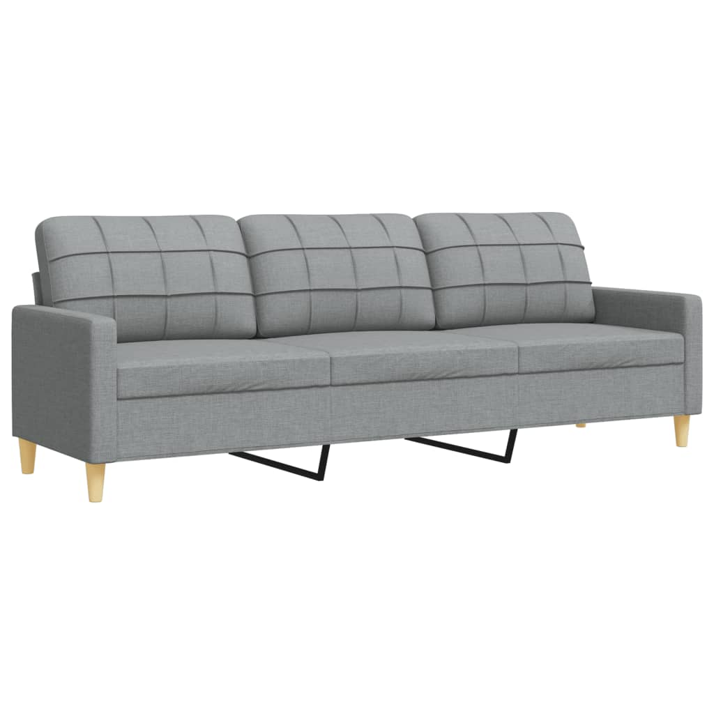 Ein graues Sofa mit drei Kissen und hellen Holzbeinen. Weißer Hintergrund.
