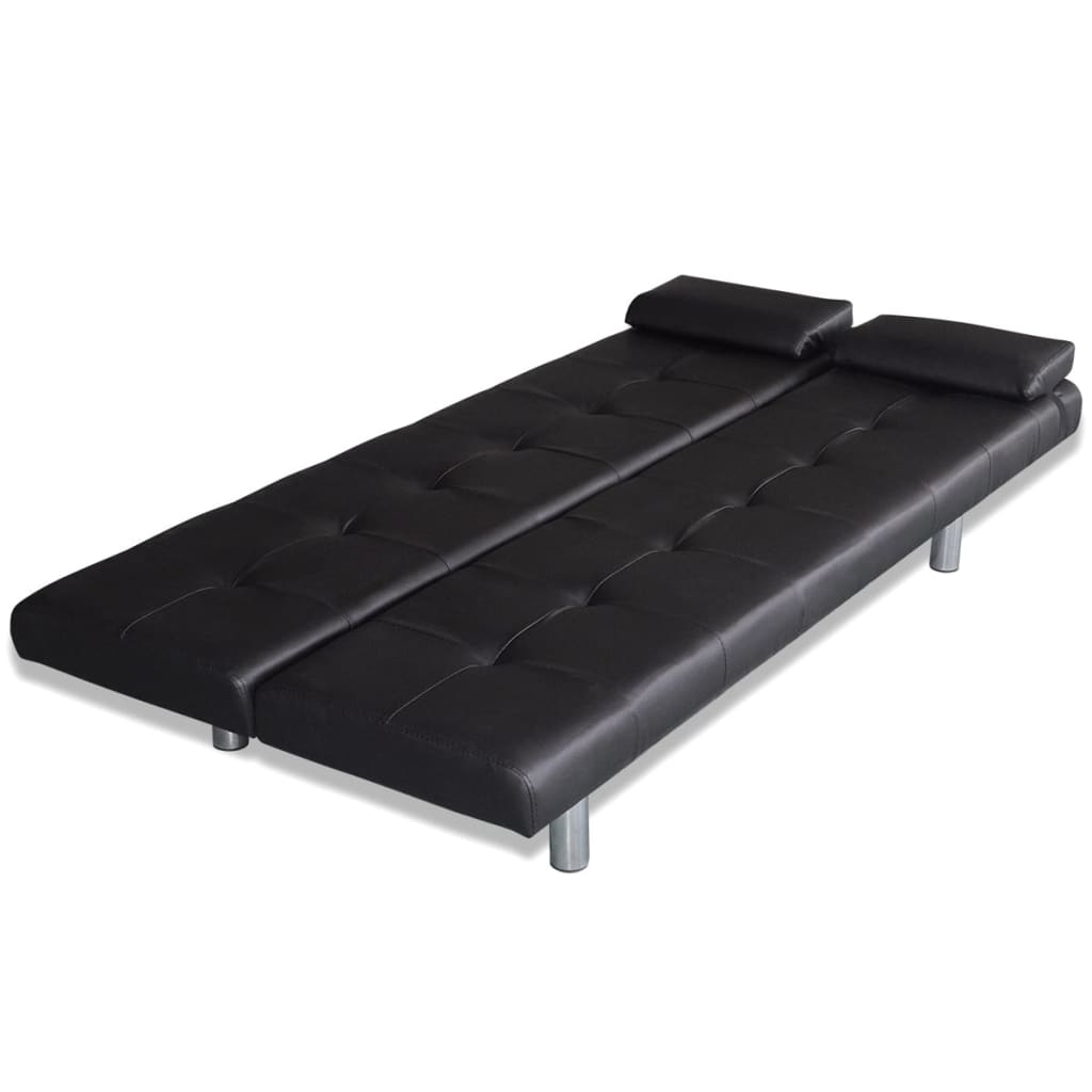 Ein schwarzes Futon-Sofa. Es ist offen, mit zwei Kopfstützen. Die Farbe ist schwarz.