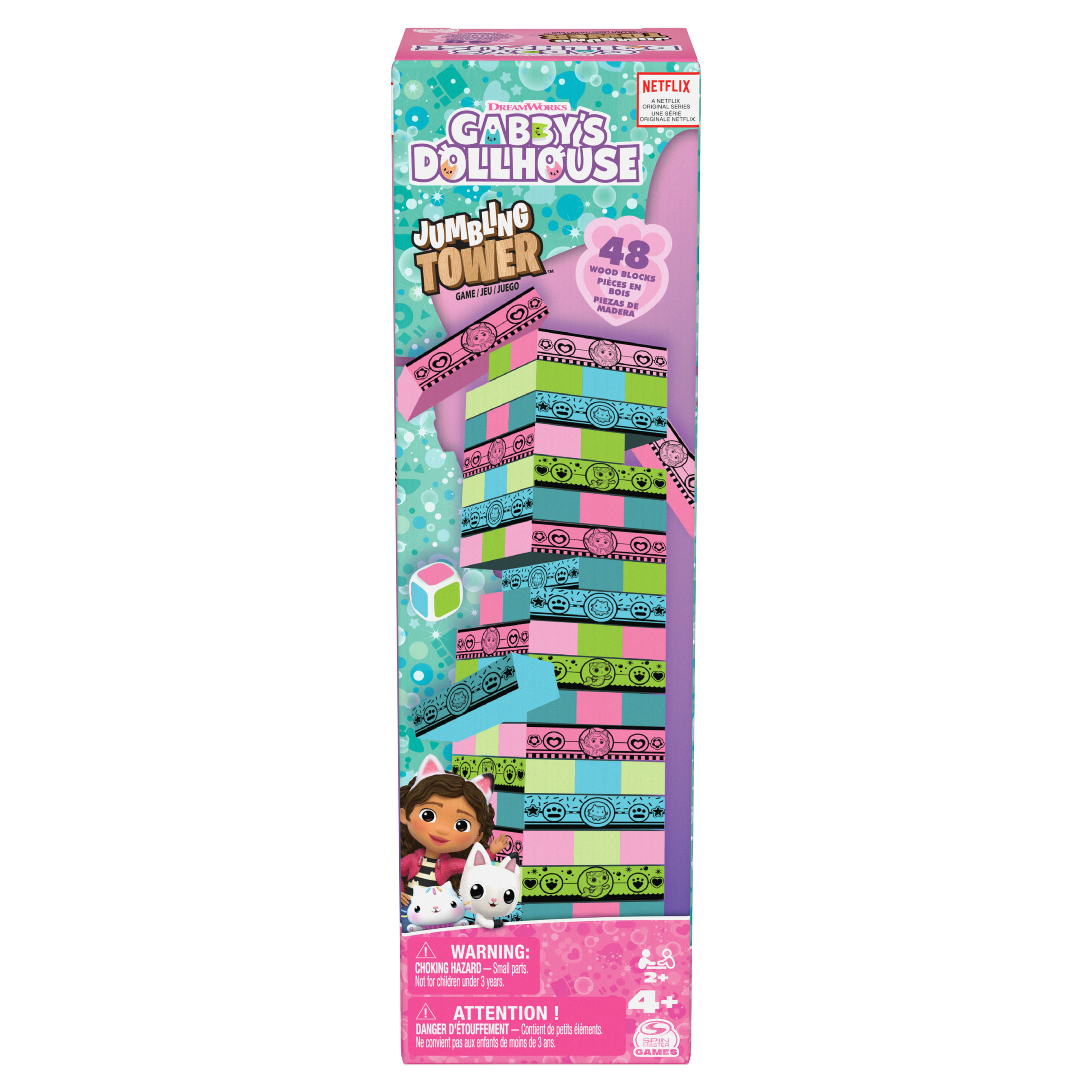 Gra w pudełku Gabby's Dollhouse Jumbling Tower. Wieża jest zbudowana z kolorowych klocków. Pudełko ma postacie.