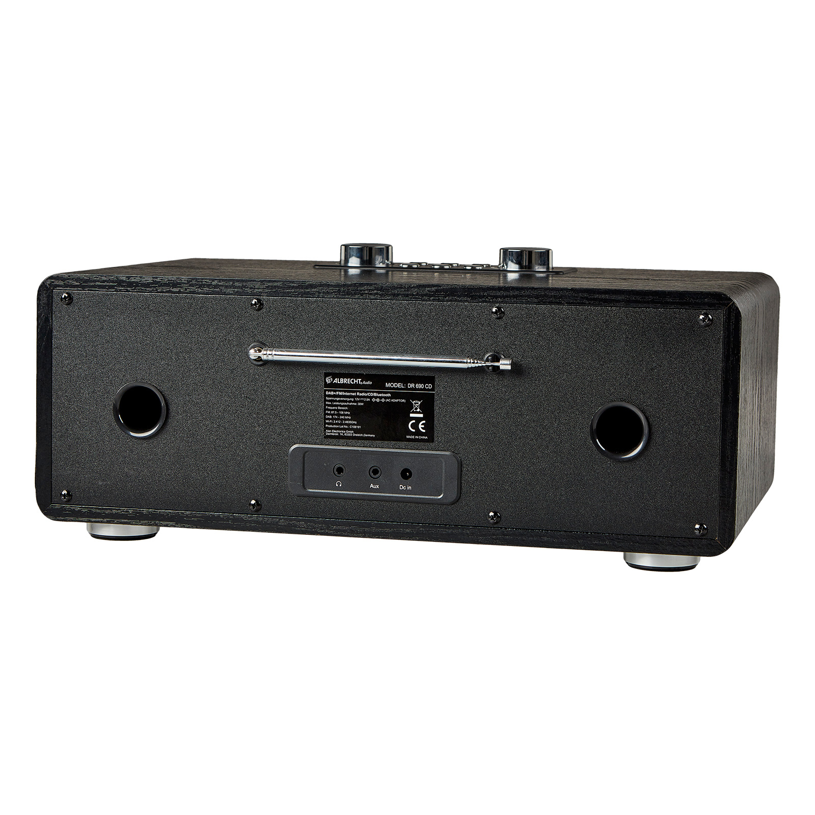 Czarno-drewniane radio z przyciskami, anteną i portami. Widok z tyłu na białym tle.