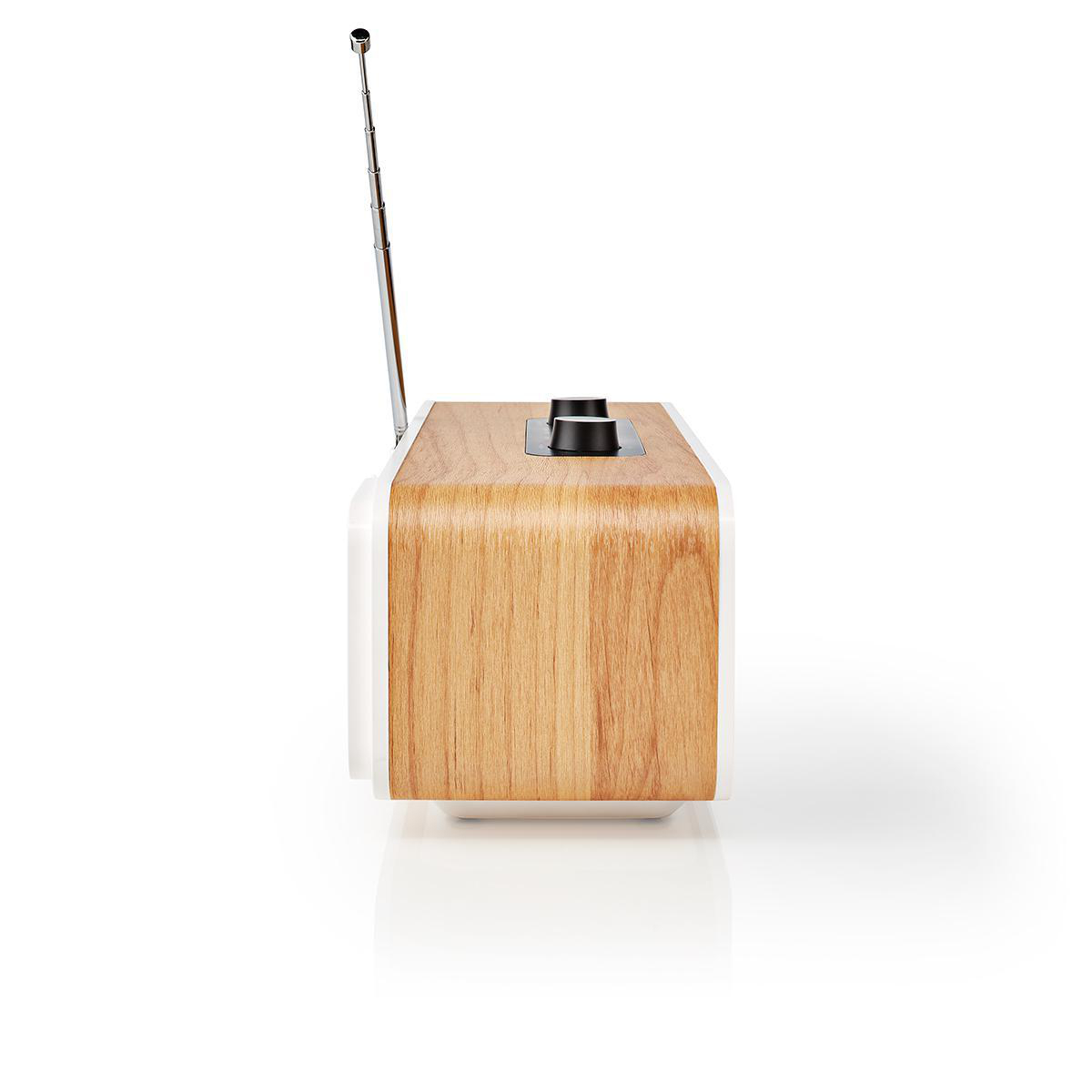 Radio con fronte in legno e lati bianchi. Antenna e due manopole di controllo sopra.