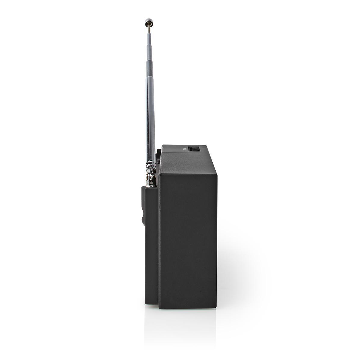 Czarny radio z srebrną anteną. Radio znajduje się na białej powierzchni. Antena jest rozłożona.