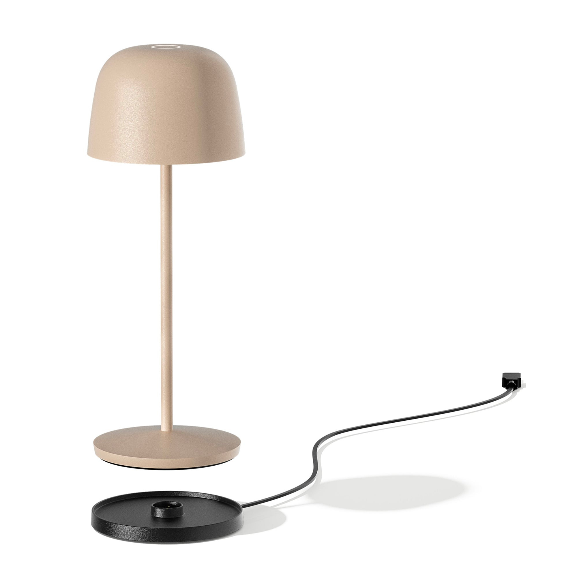 Beige Lampe mit schwarzem Fuß. Ein schwarzes Kabel verbindet die Lampe mit einer Stromquelle.