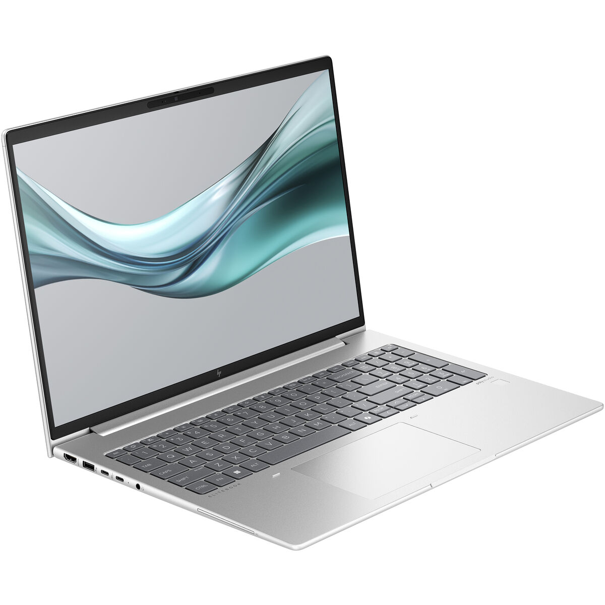 Portátil plateado con pantalla abierta, mostrando un diseño fluido verde y gris. Fondo blanco.