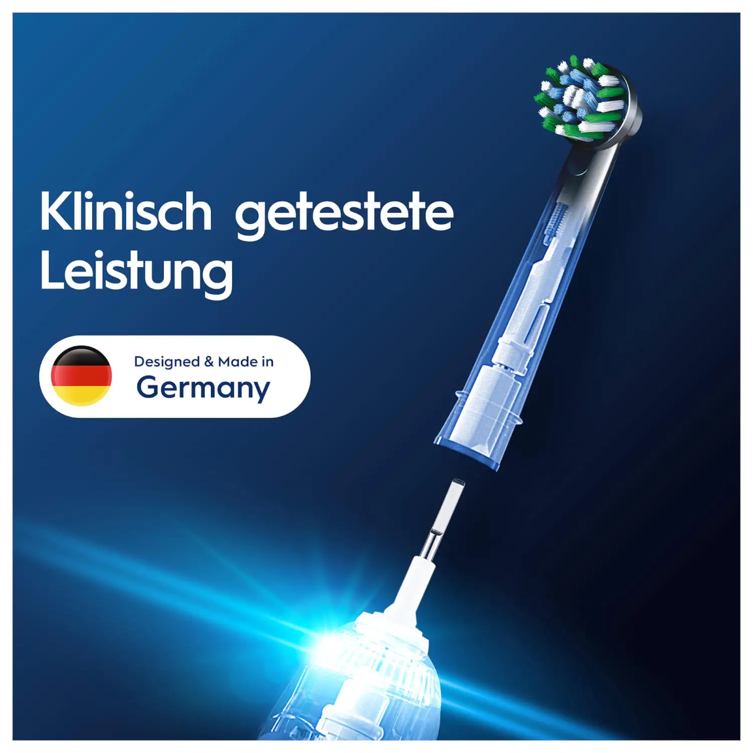 Główka szczoteczki do zębów z zielonym włosiem, białą rączką i tekstem, na niebieskim tle.