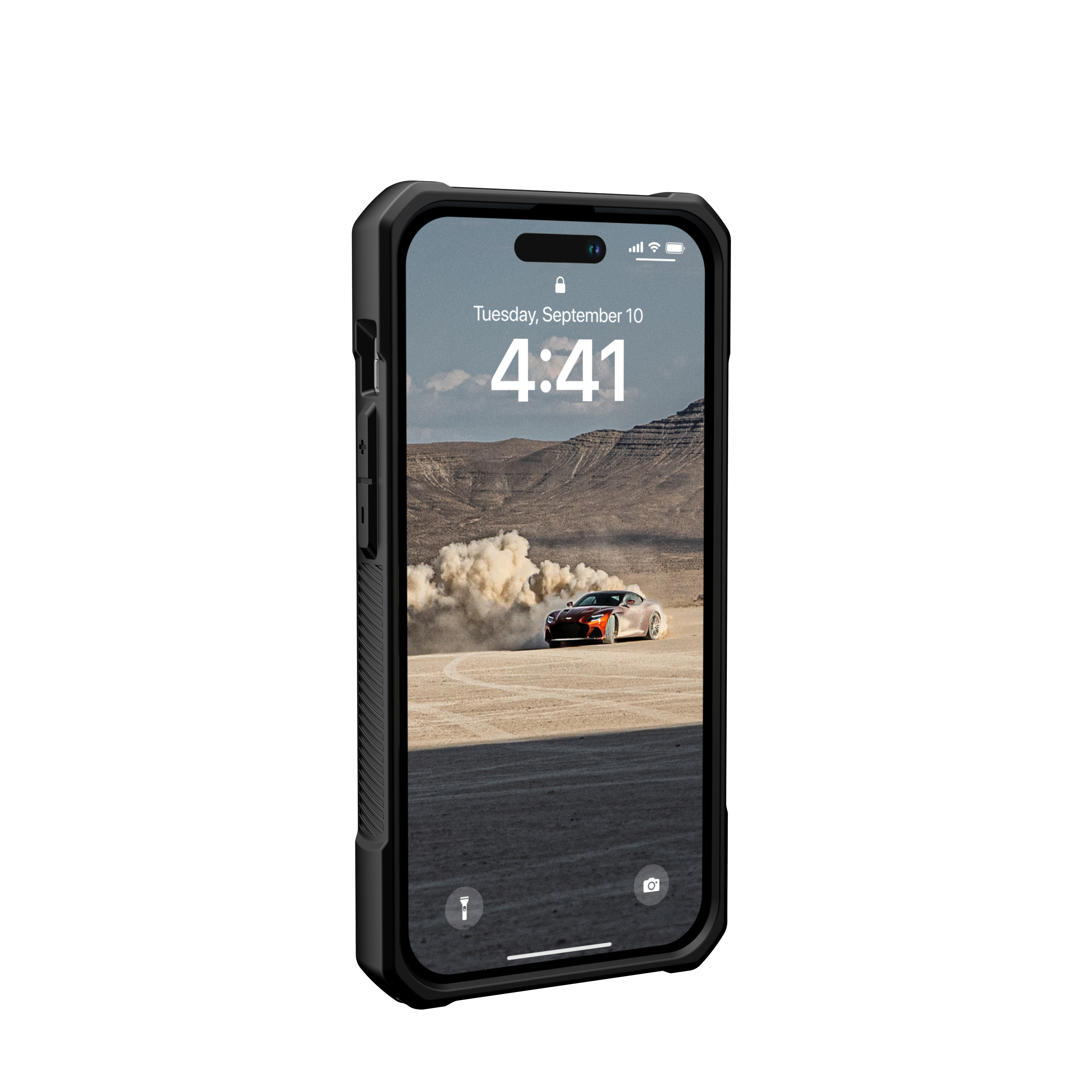 Ein schwarzes Telefon in einer schwarzen Hülle, das eine Wüstenszene mit einem Sportwagen auf dem Bildschirm zeigt.