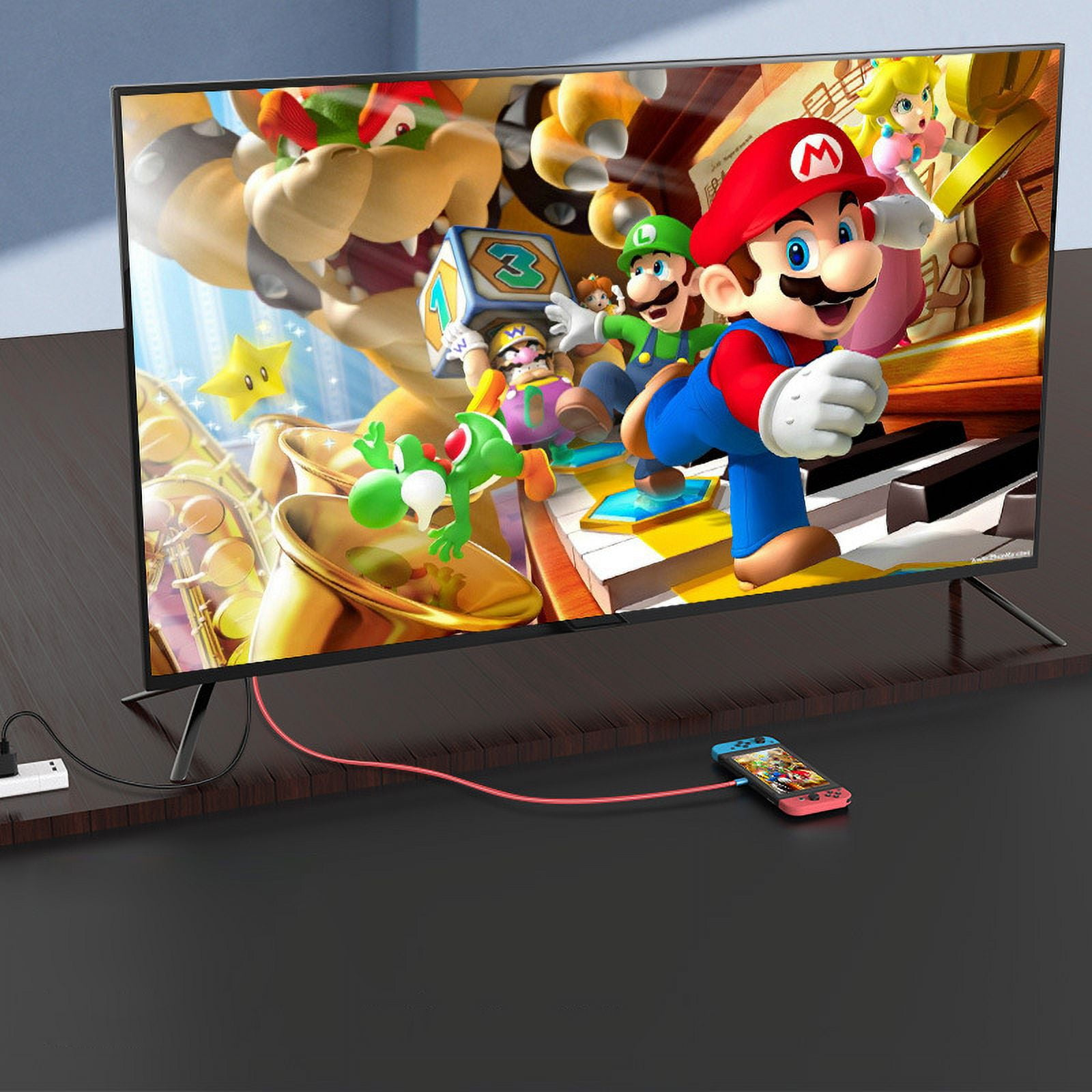 Ein Fernsehbildschirm mit Zeichentrickfiguren, verbunden mit einer Spielekonsole. Ein Gamecontroller liegt auf dem Tisch.