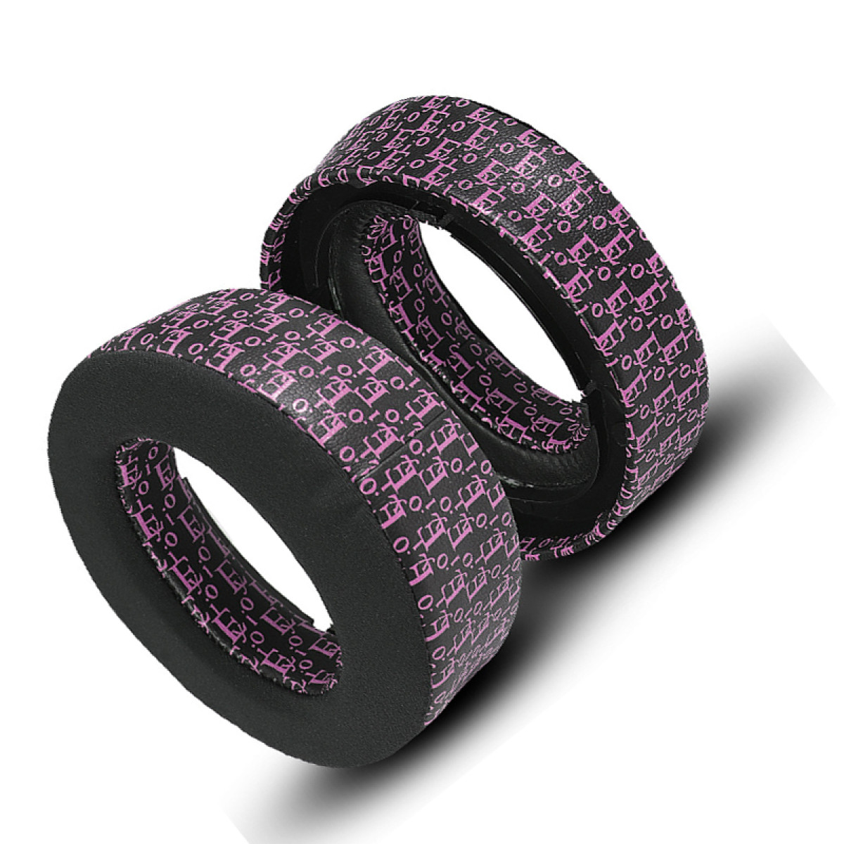 Due cuscinetti neri per auricolari con motivi rosa. Sono impilati l'uno sull'altro.