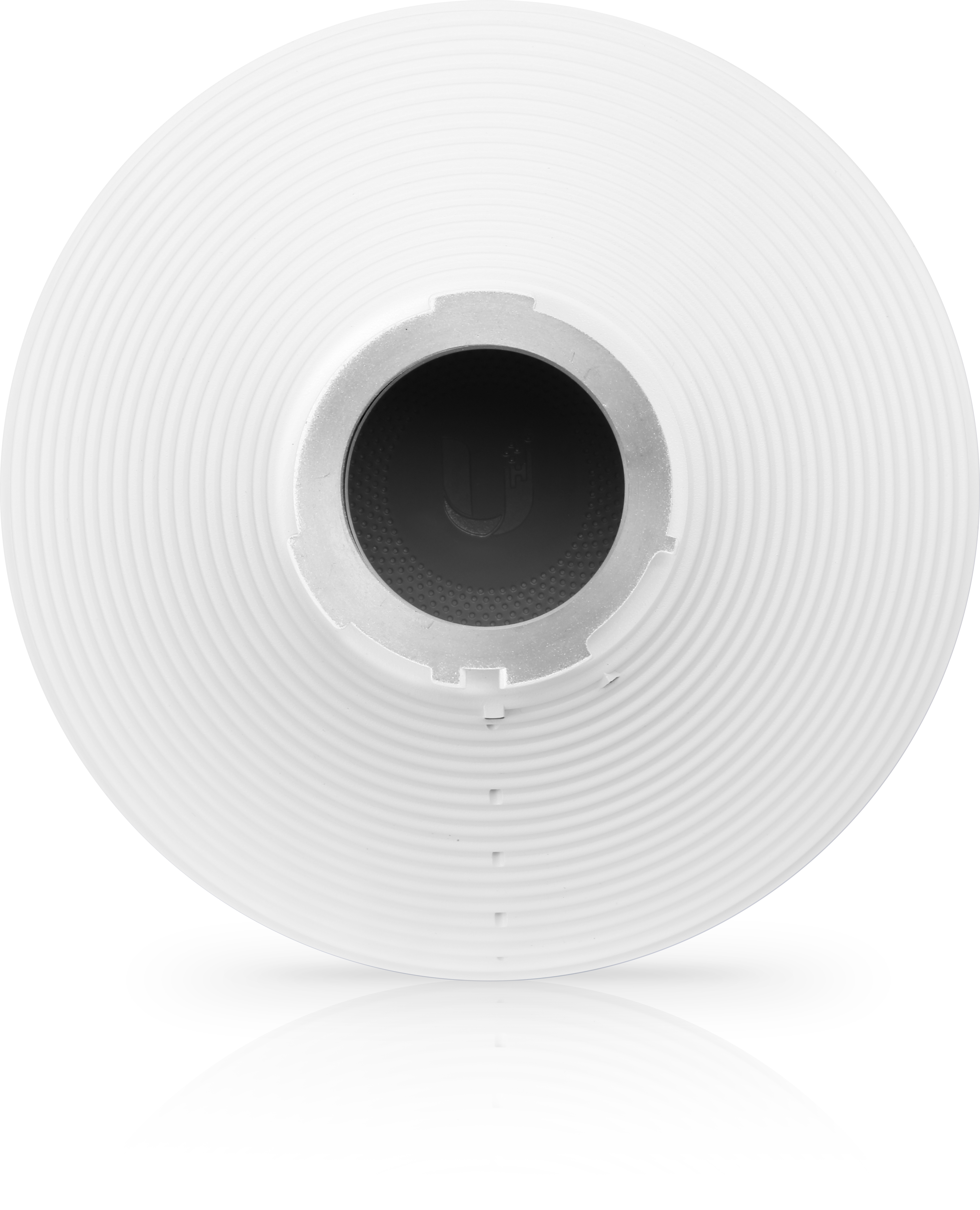 Dispositivo circular blanco con centro metálico. Tiene anillos concéntricos. Fondo sombreado.
