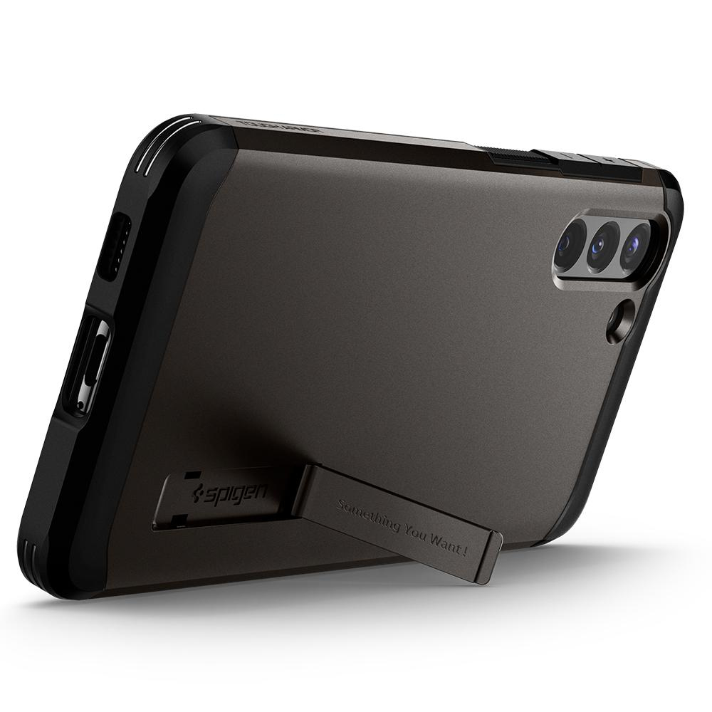 Donkergrijze telefoonhoes met een standaard. De telefoonhoes heeft een zwarte rand en een zwarte standaard.