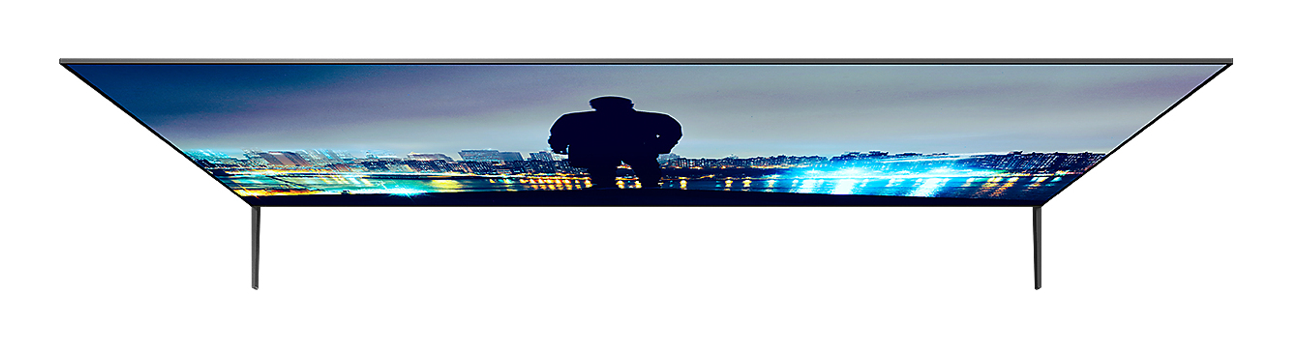 Una pantalla de TV con la silueta de una persona y luces de la ciudad.