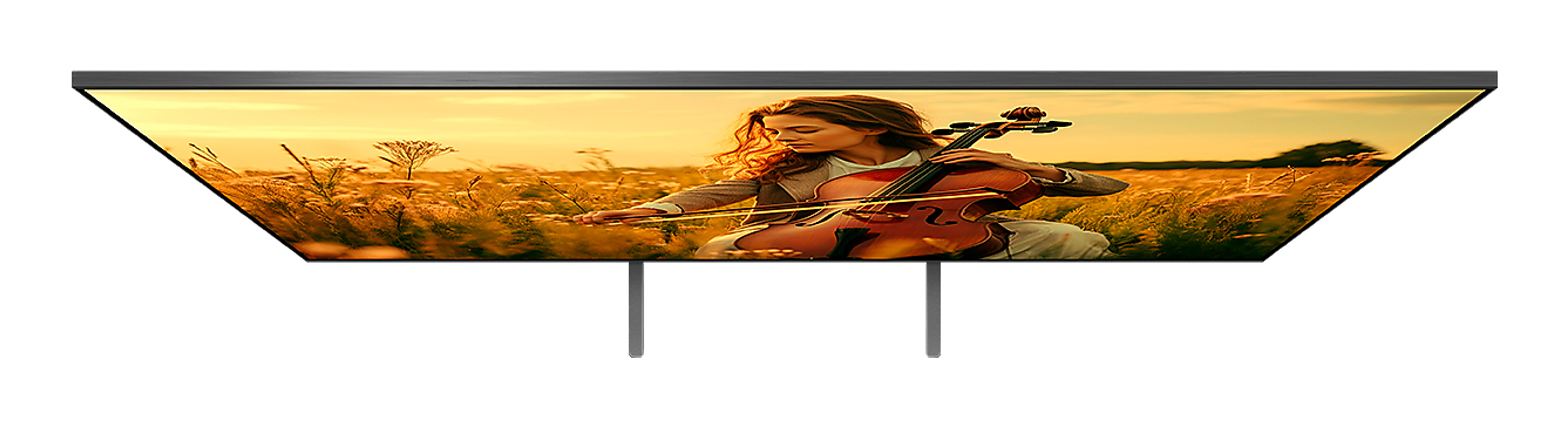 TV-Bildschirm, der eine Frau zeigt, die Cello in einem Feld bei Sonnenuntergang spielt.