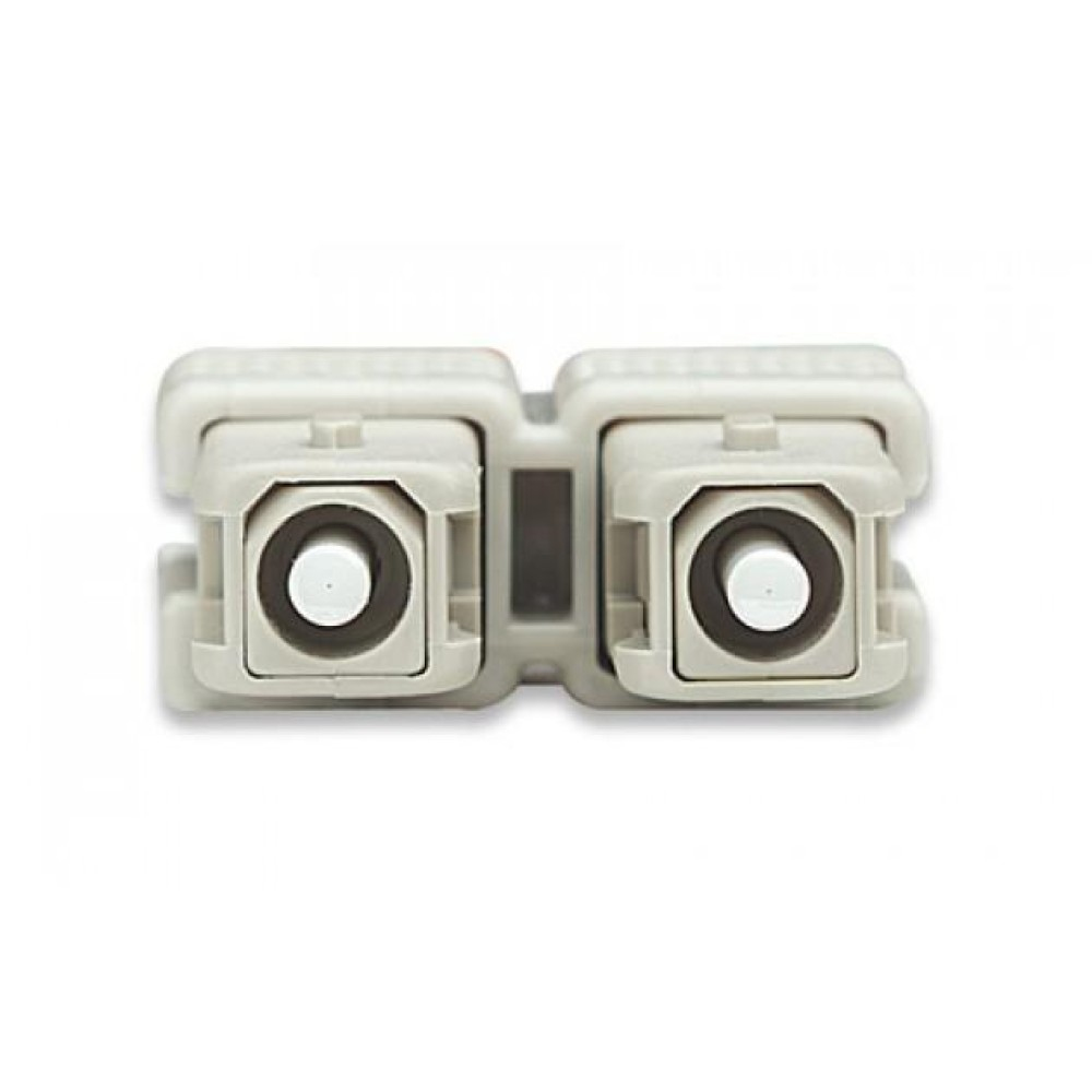 Un accoppiatore per fibra ottica grigio. L'accoppiatore ha due porte quadrate.