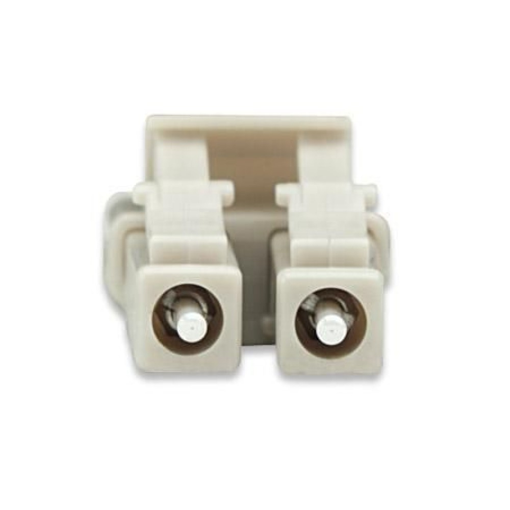 Primo piano di un connettore in fibra ottica beige con due porte allineate.