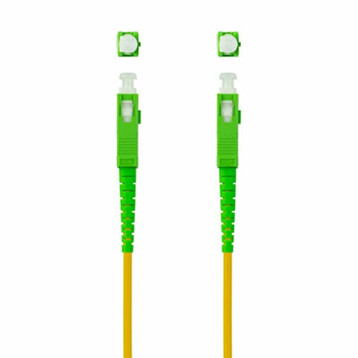 Dos conectores verdes con cables amarillos. Cada uno tiene una tapa cuadrada y un cuerpo verde.
