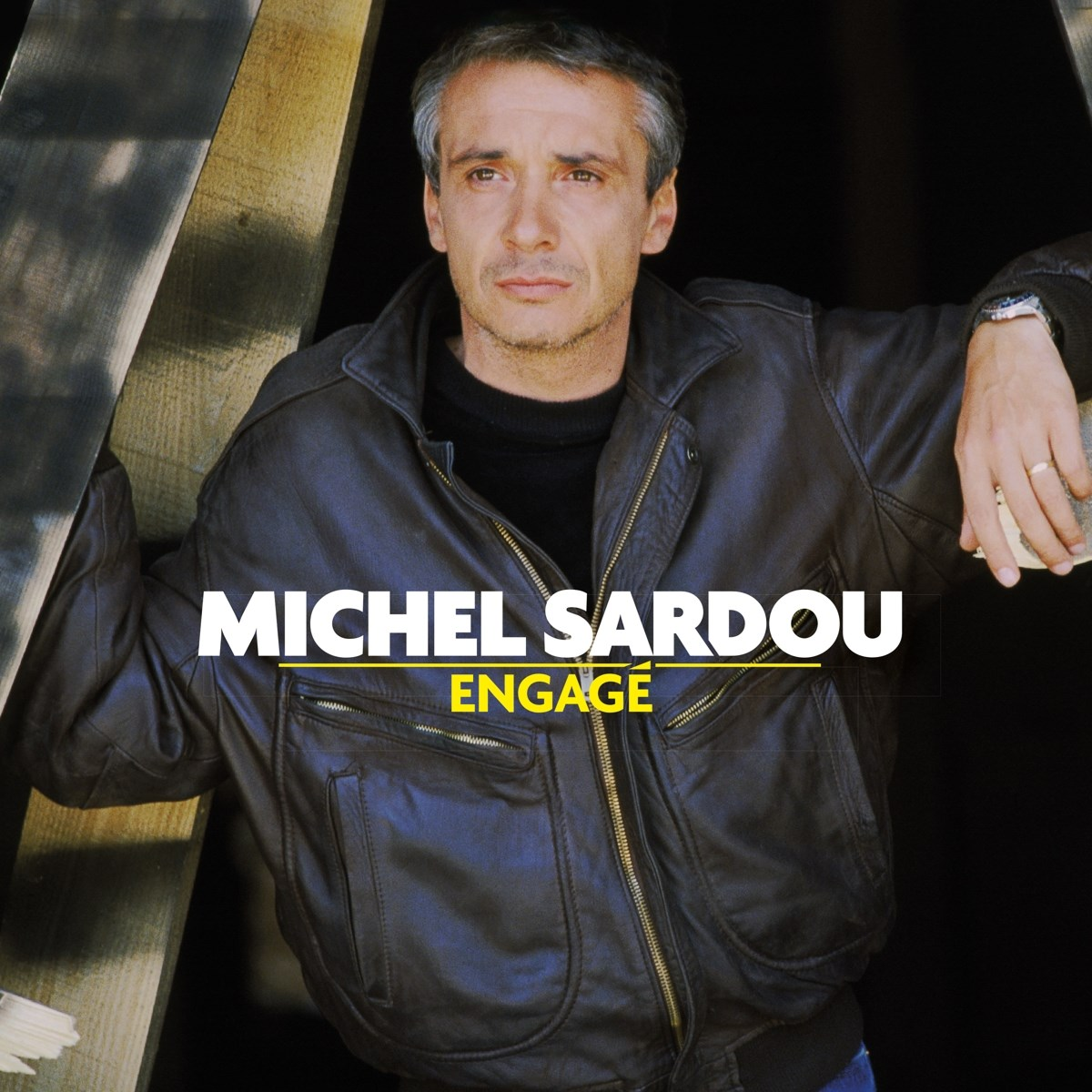 Copertina dell'album, uomo con giacca di pelle, testo "Michel Sardou Engagé".