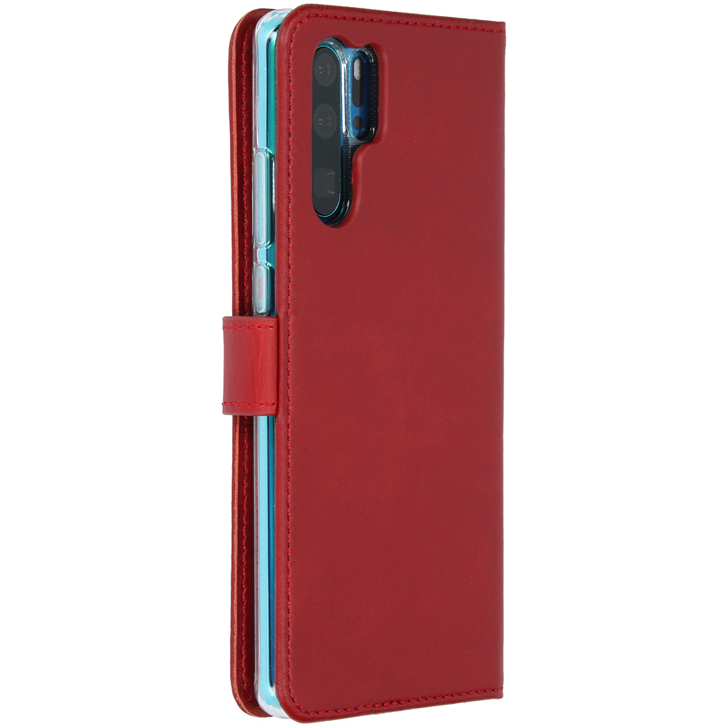 Red phone case. Side view, open. Phone in case, with camera visible. Wallet style, red, magnetic closure.