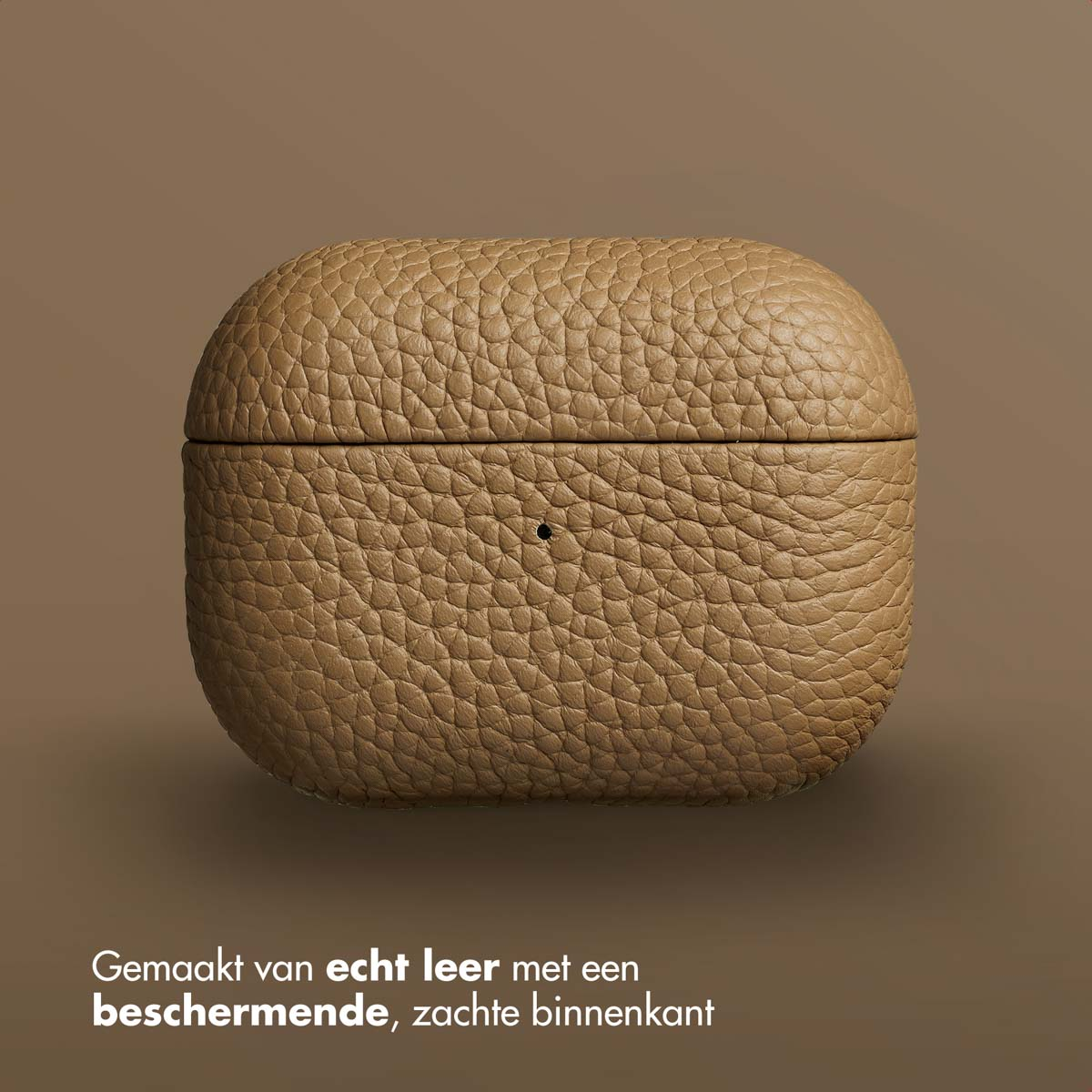 Tan textured leather AirPod case. The case is closed, with a small hole and a brown background.