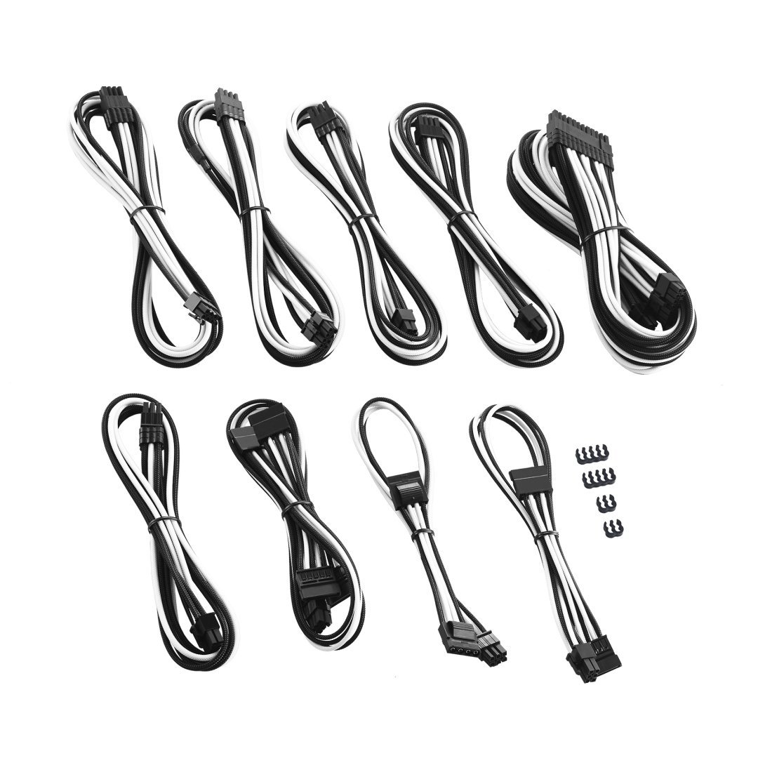 Varios cables blancos y negros con conectores. Son para computadoras.
