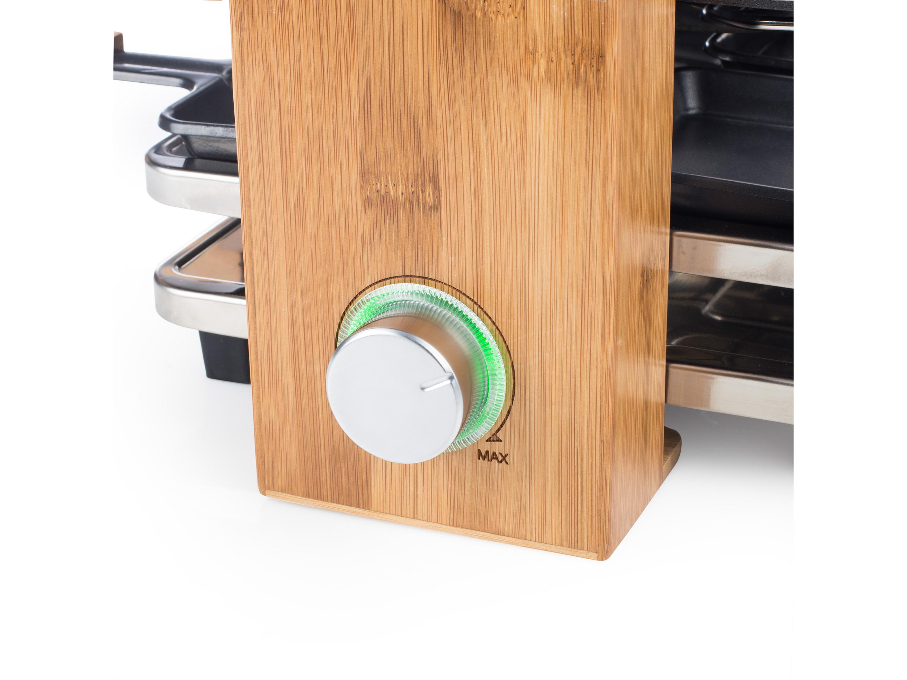Griglia per raclette in legno con manopola argentata. Luce verde accesa. Legno di bambù.