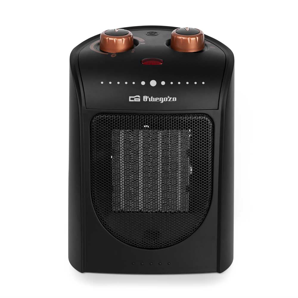 Czarny i miedziany grzejnik elektryczny. Posiada kratkę i dwa pokrętła regulacyjne na górze.