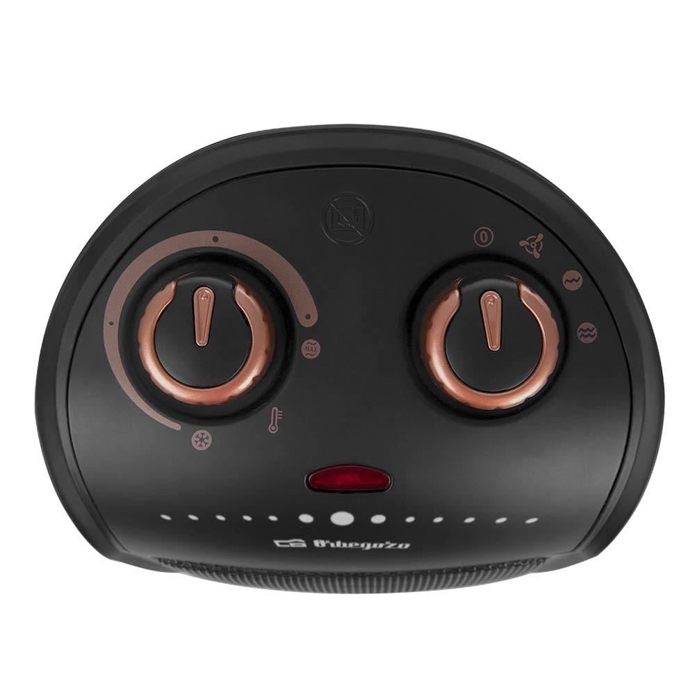 Czarny grzejnik elektryczny z dwoma pokrętłami i czerwonym światłem, różowo-złote akcenty.