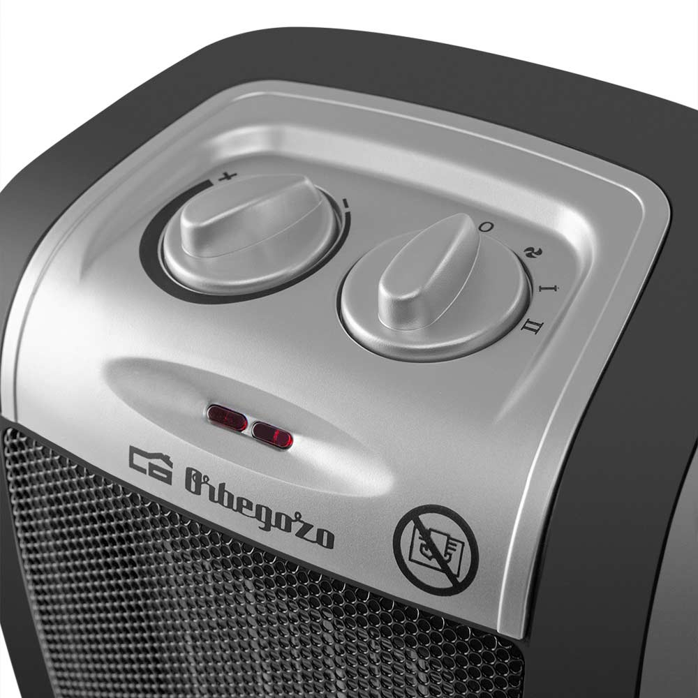 Srebrno-czarny grzejnik z pokrętłami i czarną kratką.