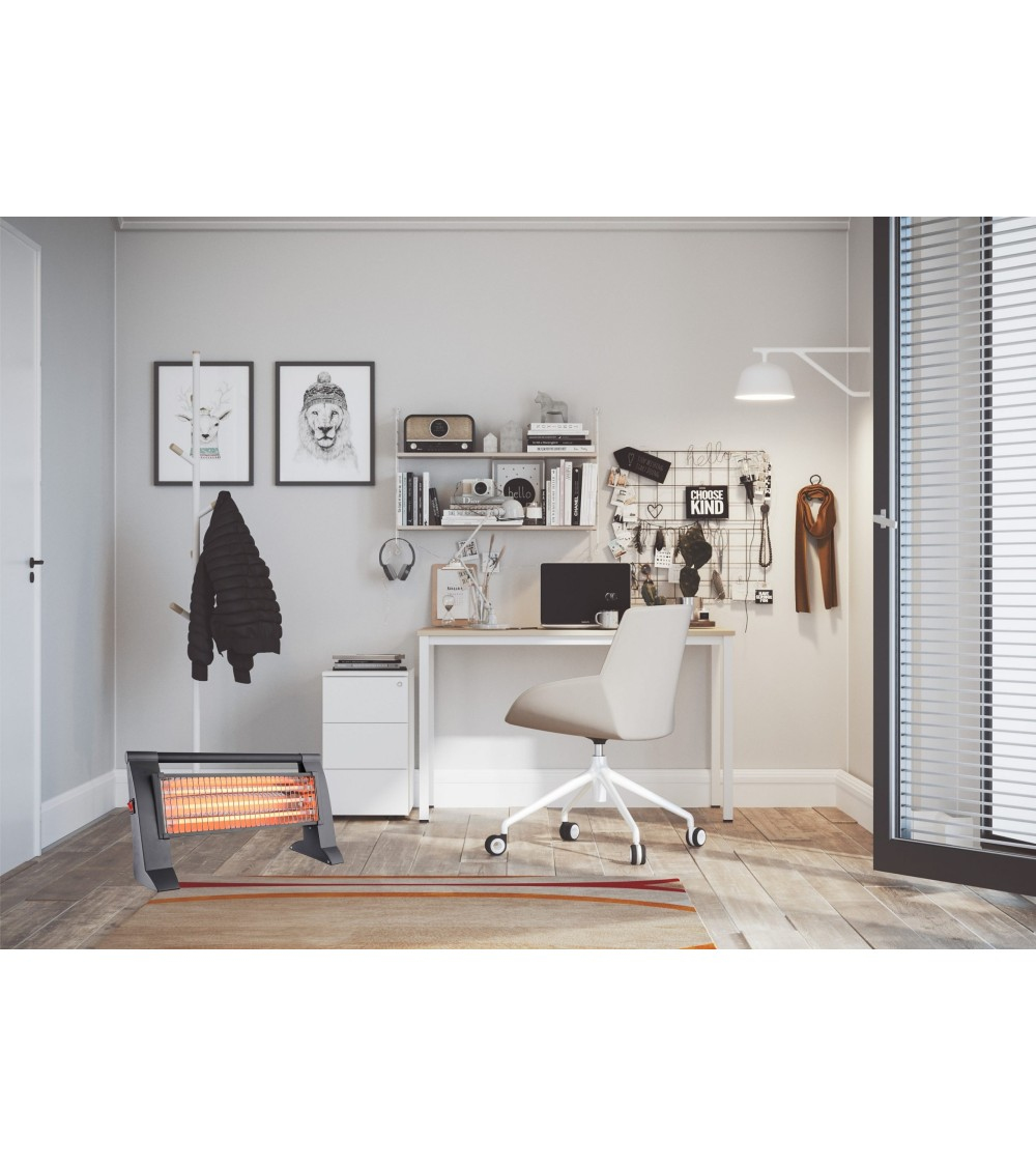 Una habitación con escritorio, silla y calefactor. Hay dos cuadros en la pared.