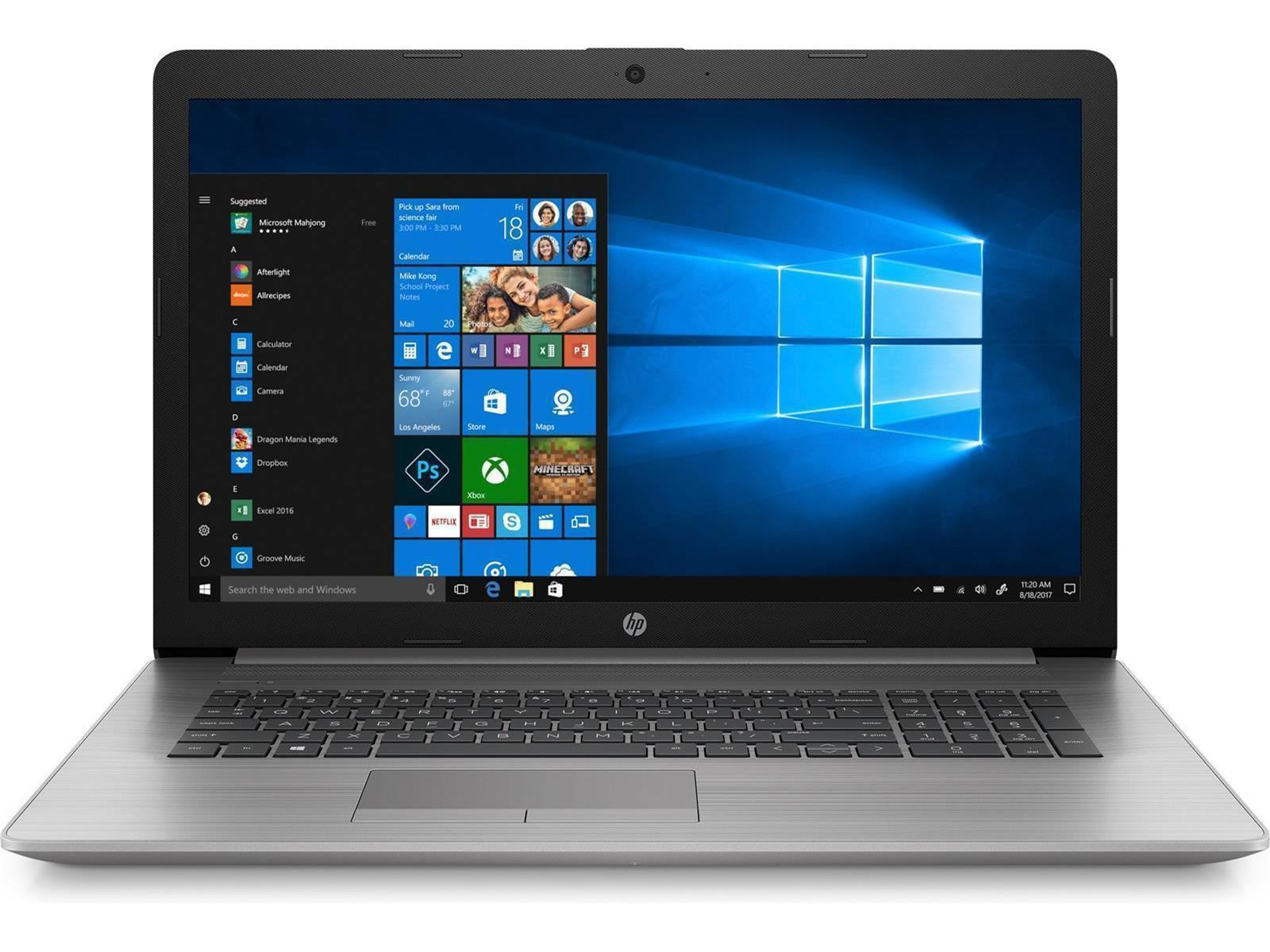Laptop mit Windows-Desktop. Es ist geöffnet und auf einem Tisch.